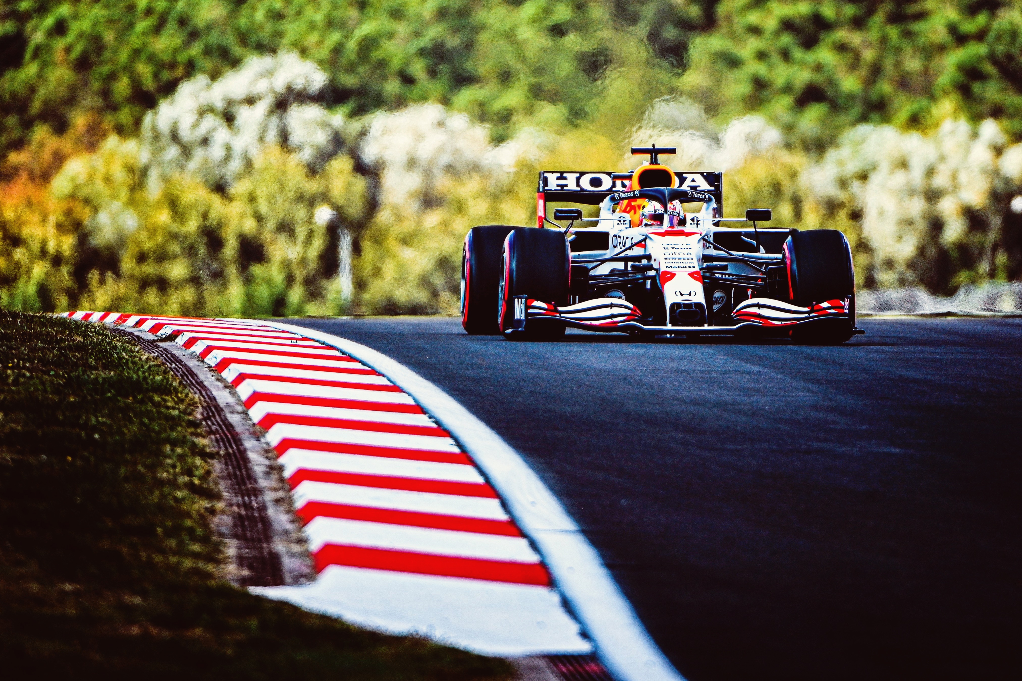 Formula 1 car on a race track HD Wallpaper