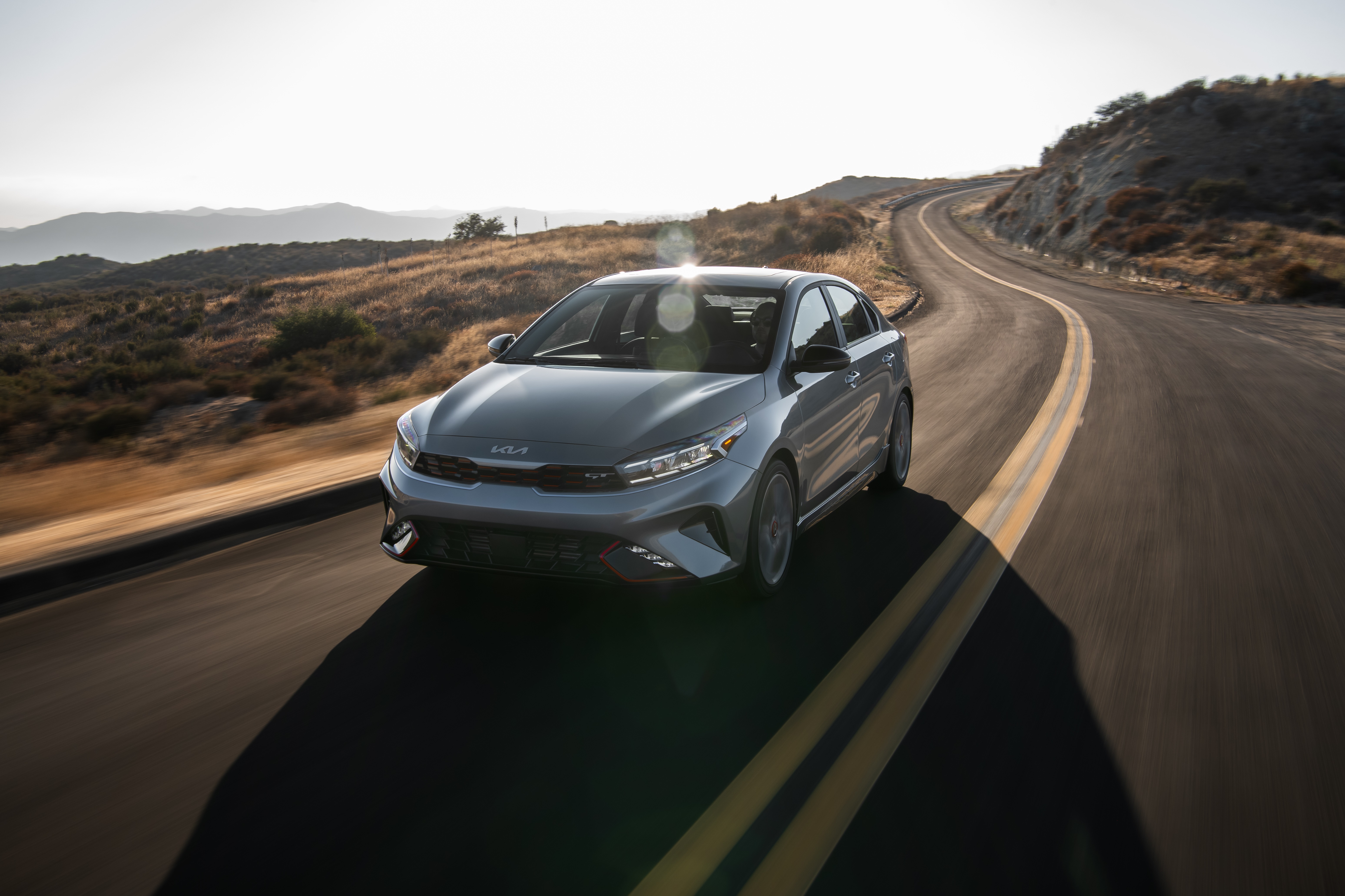Kia Forte GT 4K Sedan on a Winding Road HD Wallpaper