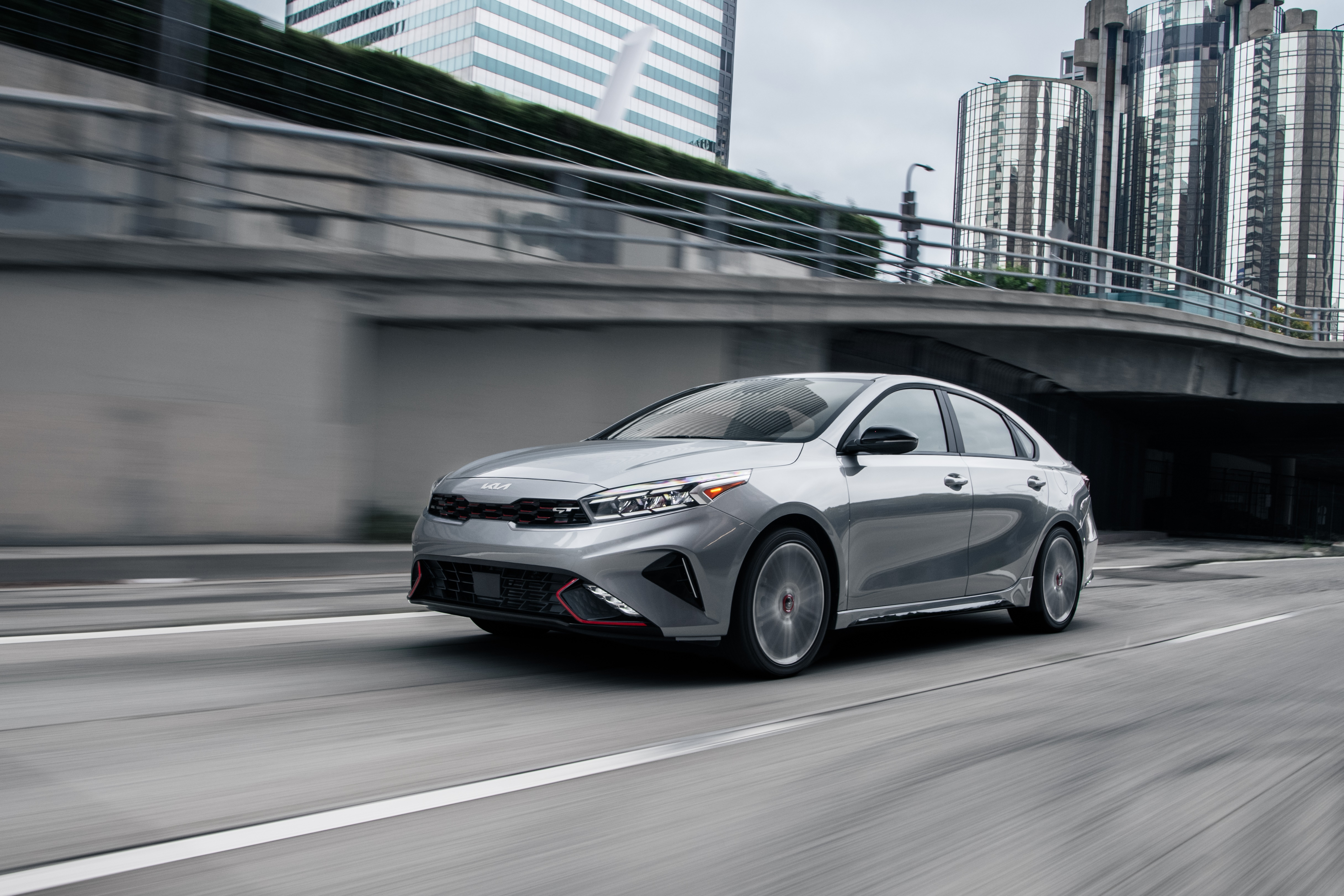 Silver Kia Forte GT 4K driving on a highway HD Wallpaper
