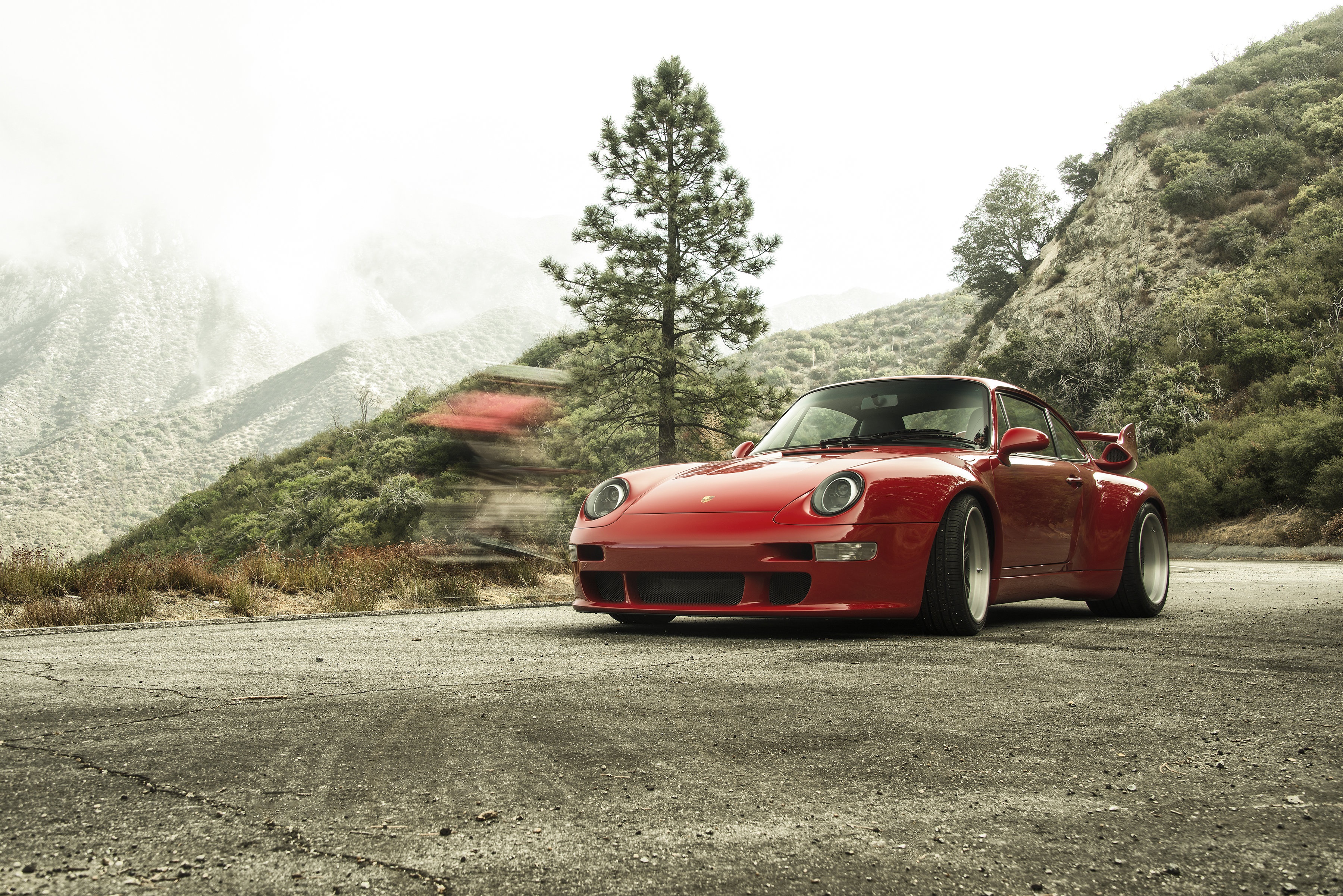 Red Porsche 993 Gunther Werks 400R on mountain road HD Wallpaper