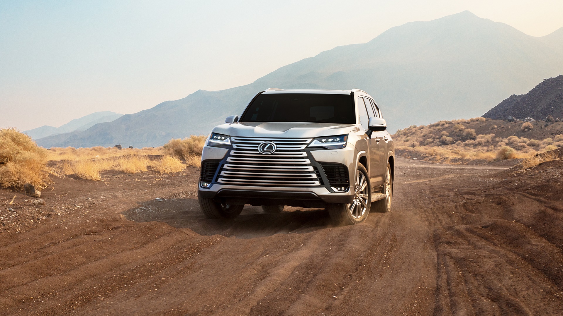 Lexus LX 600 SUV driving on a dirt road HD Wallpaper