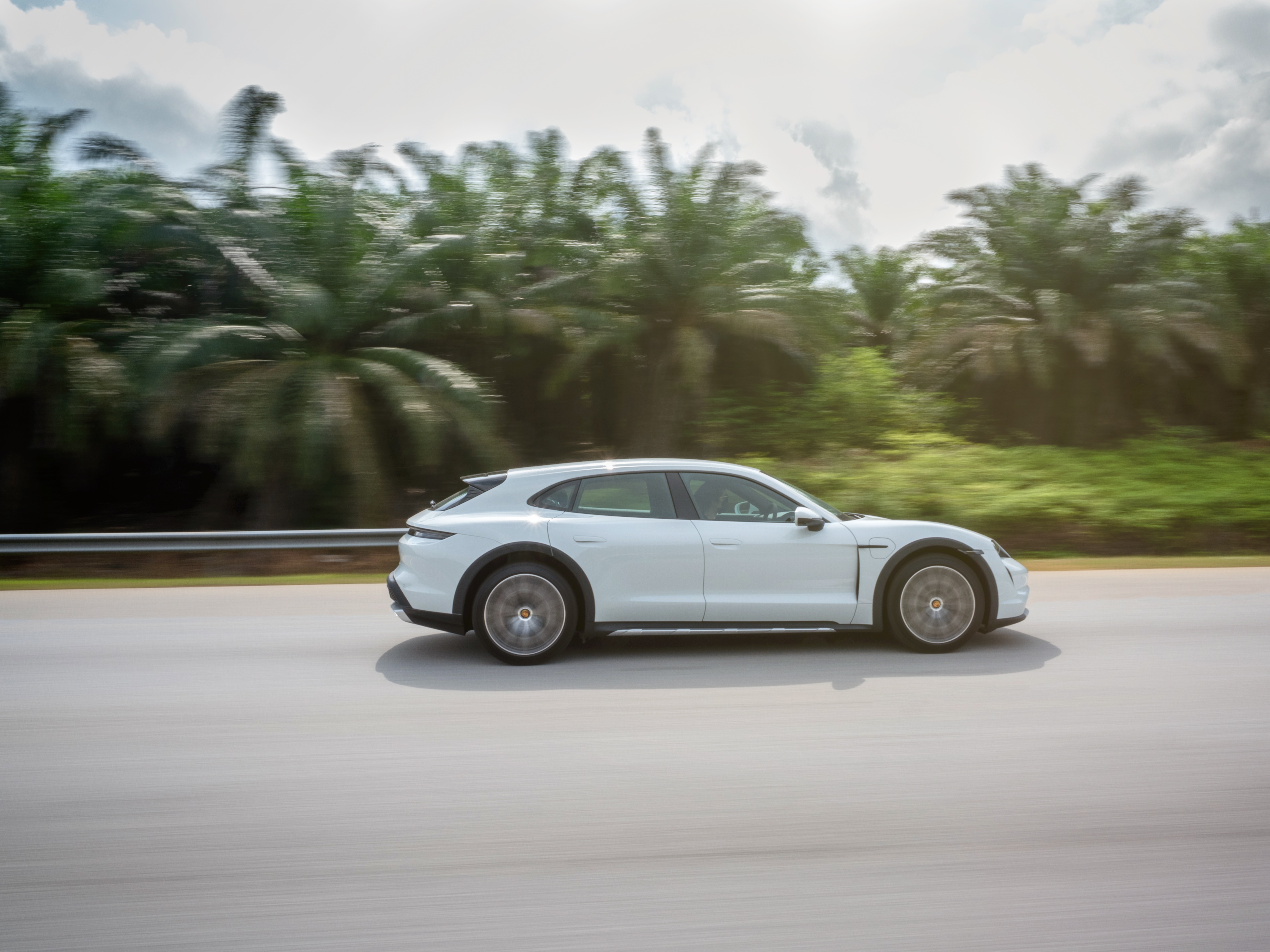 White Porsche Taycan 4S Cross Turismo driving on road HD Wallpaper