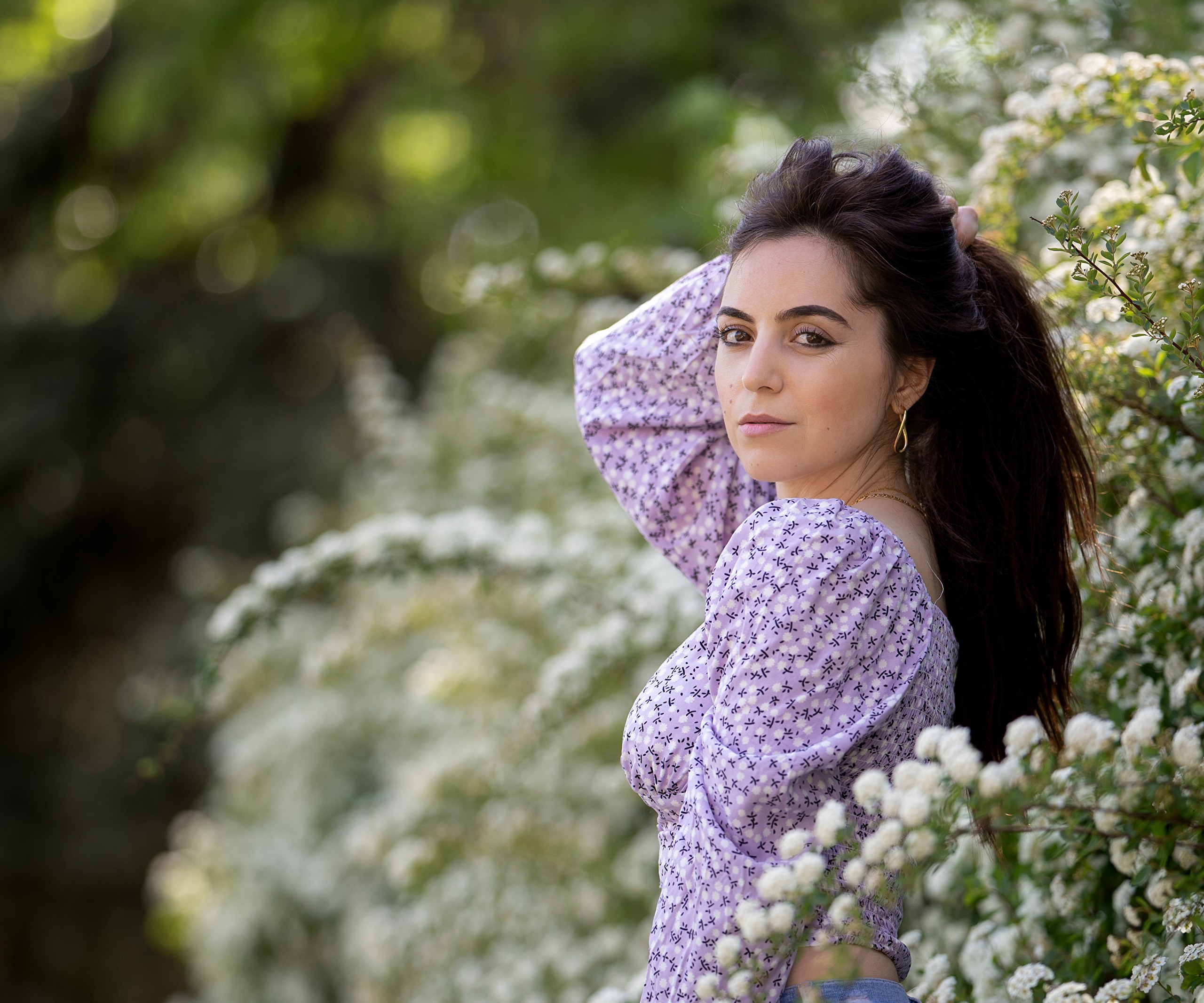 Brunette woman with dark hair in a floral top HD Wallpaper