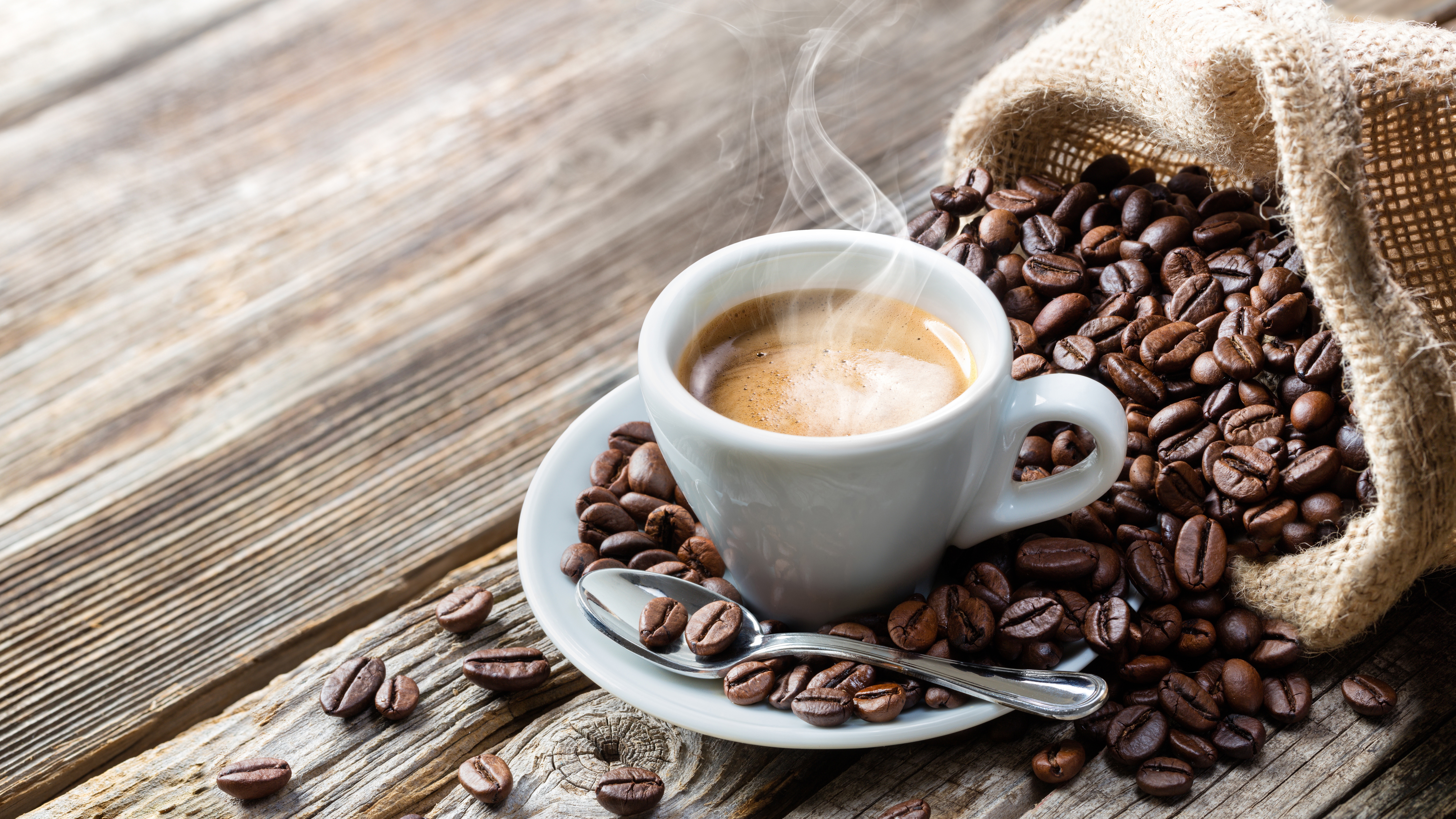 Espresso cup with coffee beans and burlap sack HD Wallpaper