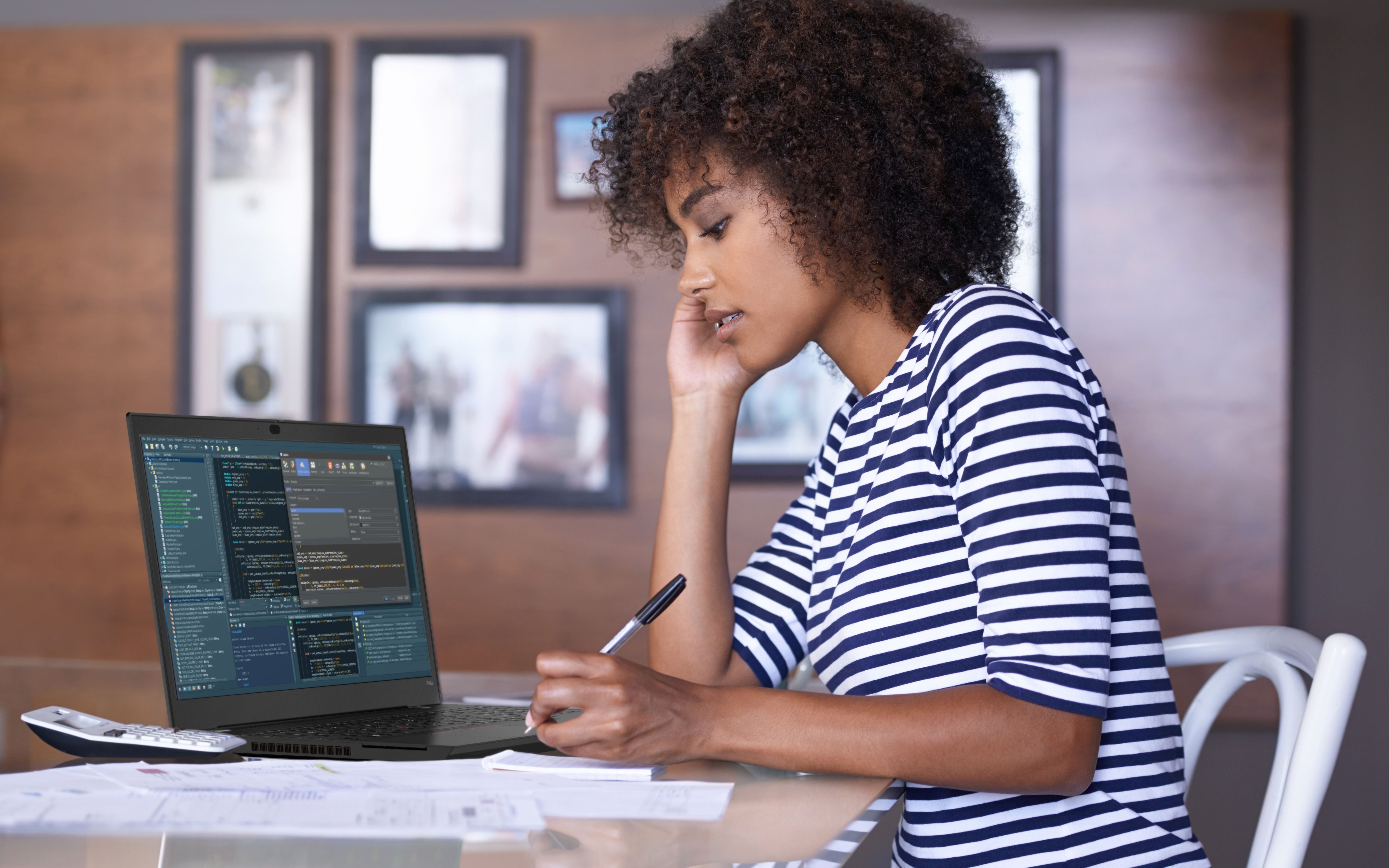 Woman working on a laptop with code HD Wallpaper