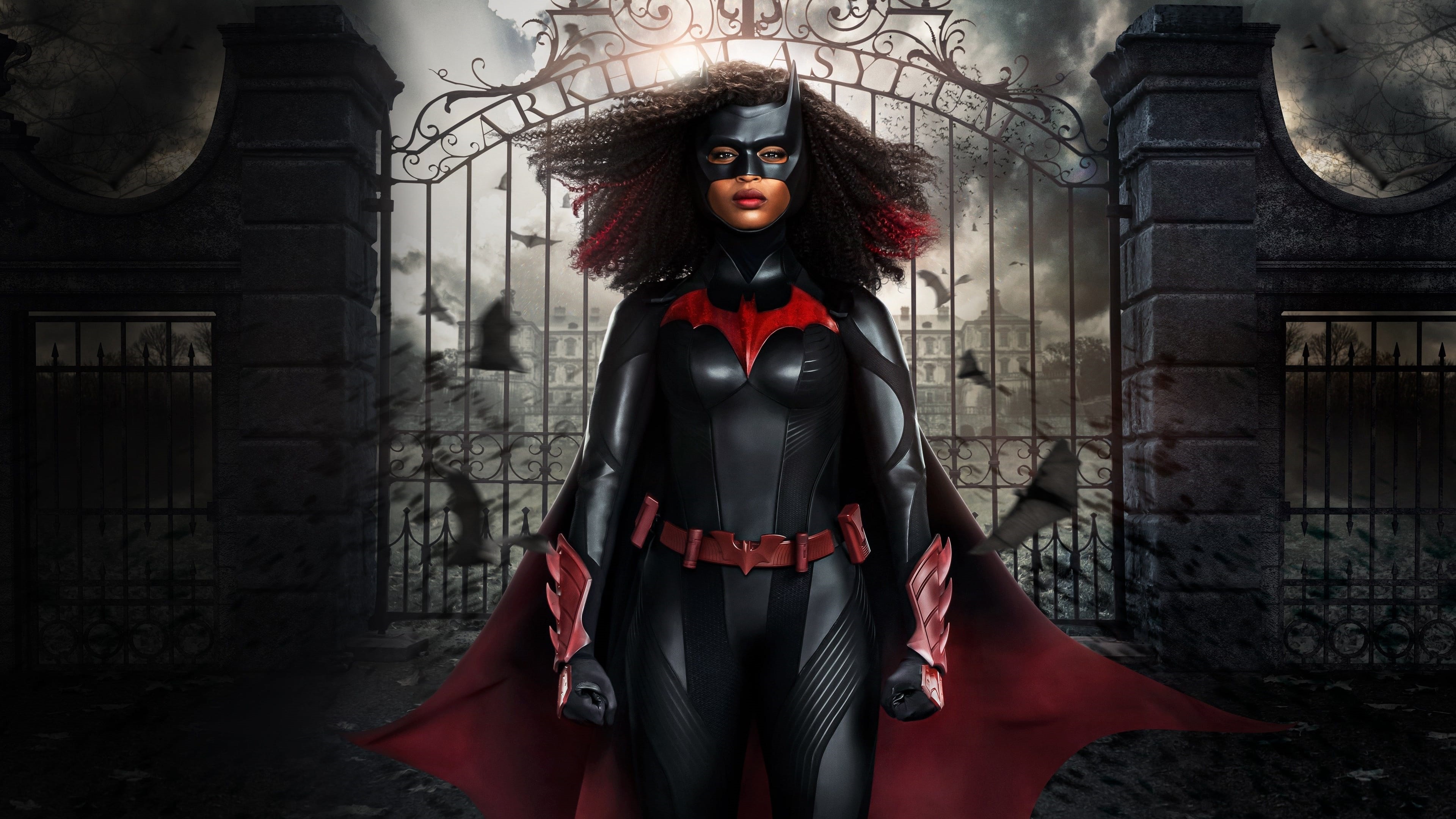 Batwoman from DC Comics in front of Arkham Asylum gates HD Wallpaper