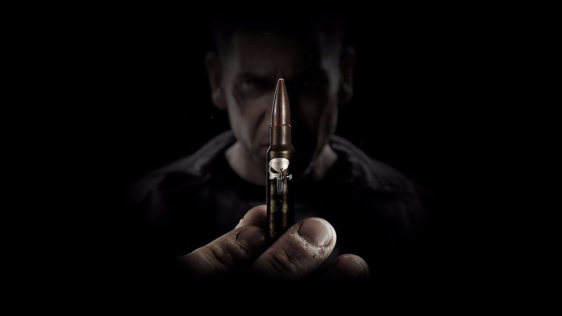 The Punisher holding a bullet HD Wallpaper