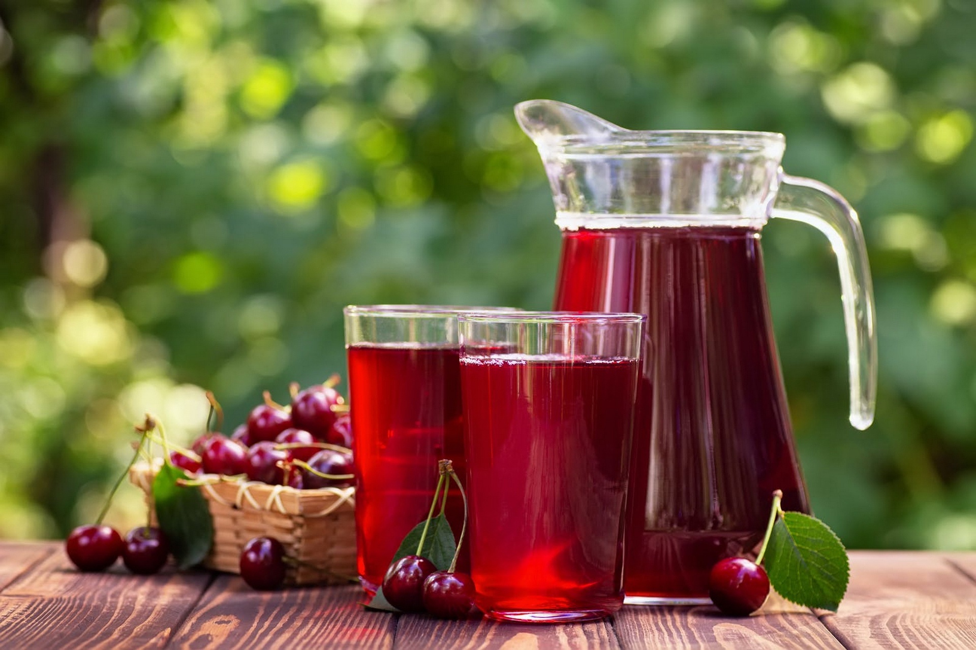 Cherry juice in glasses and pitcher with cherries HD Wallpaper