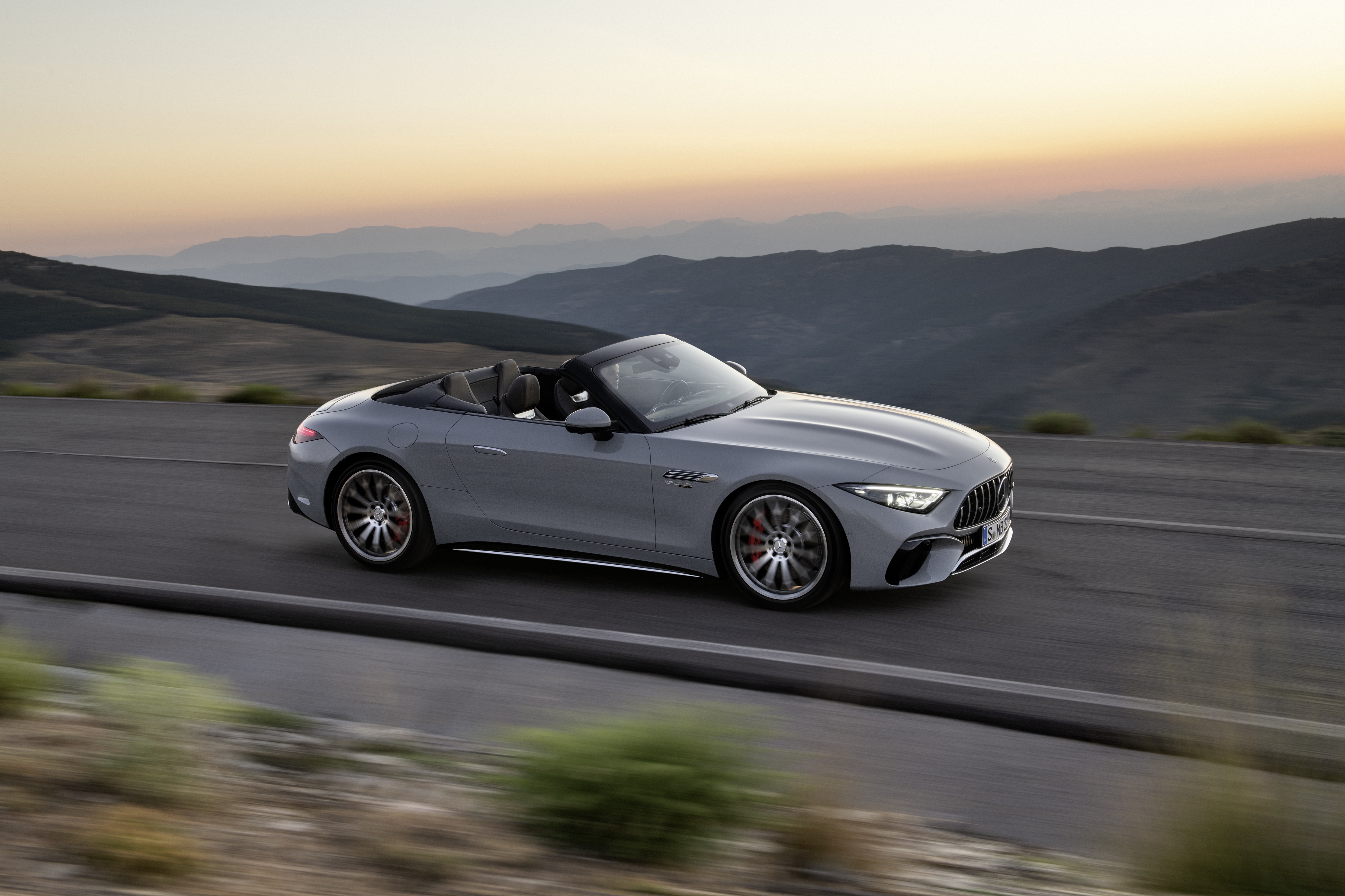 Mercedes-AMG SL 55 4MATIC convertible driving on a mountain road HD Wallpaper
