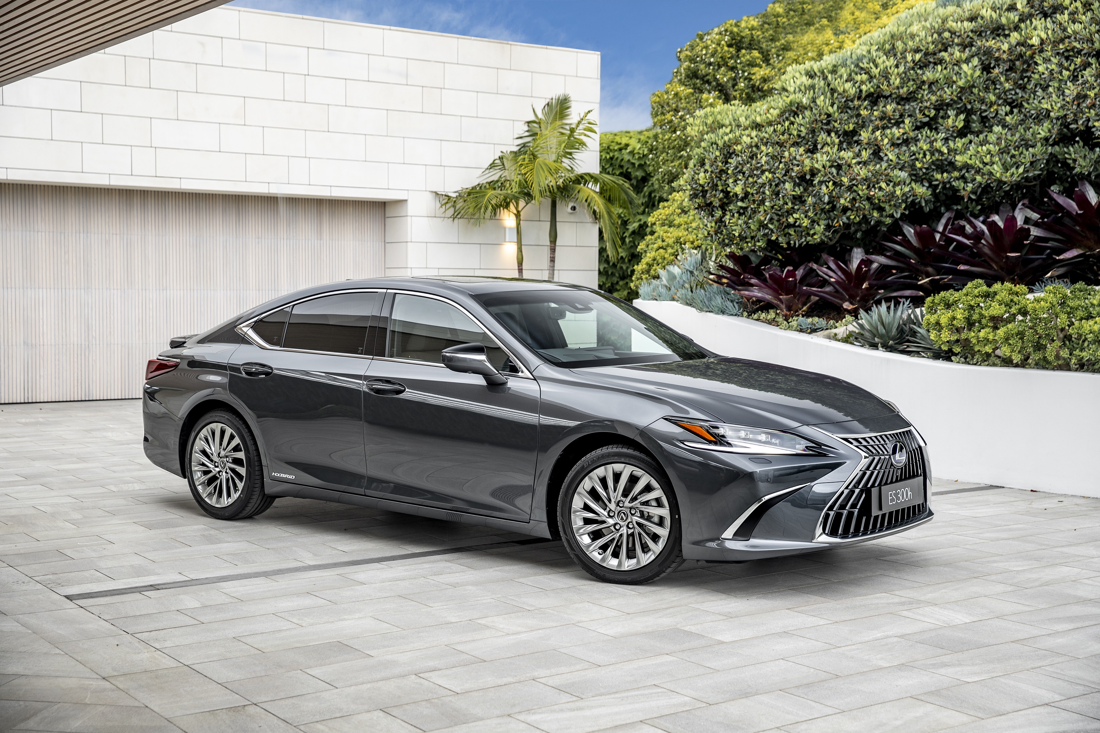 Lexus ES 300H parked in modern driveway HD Wallpaper