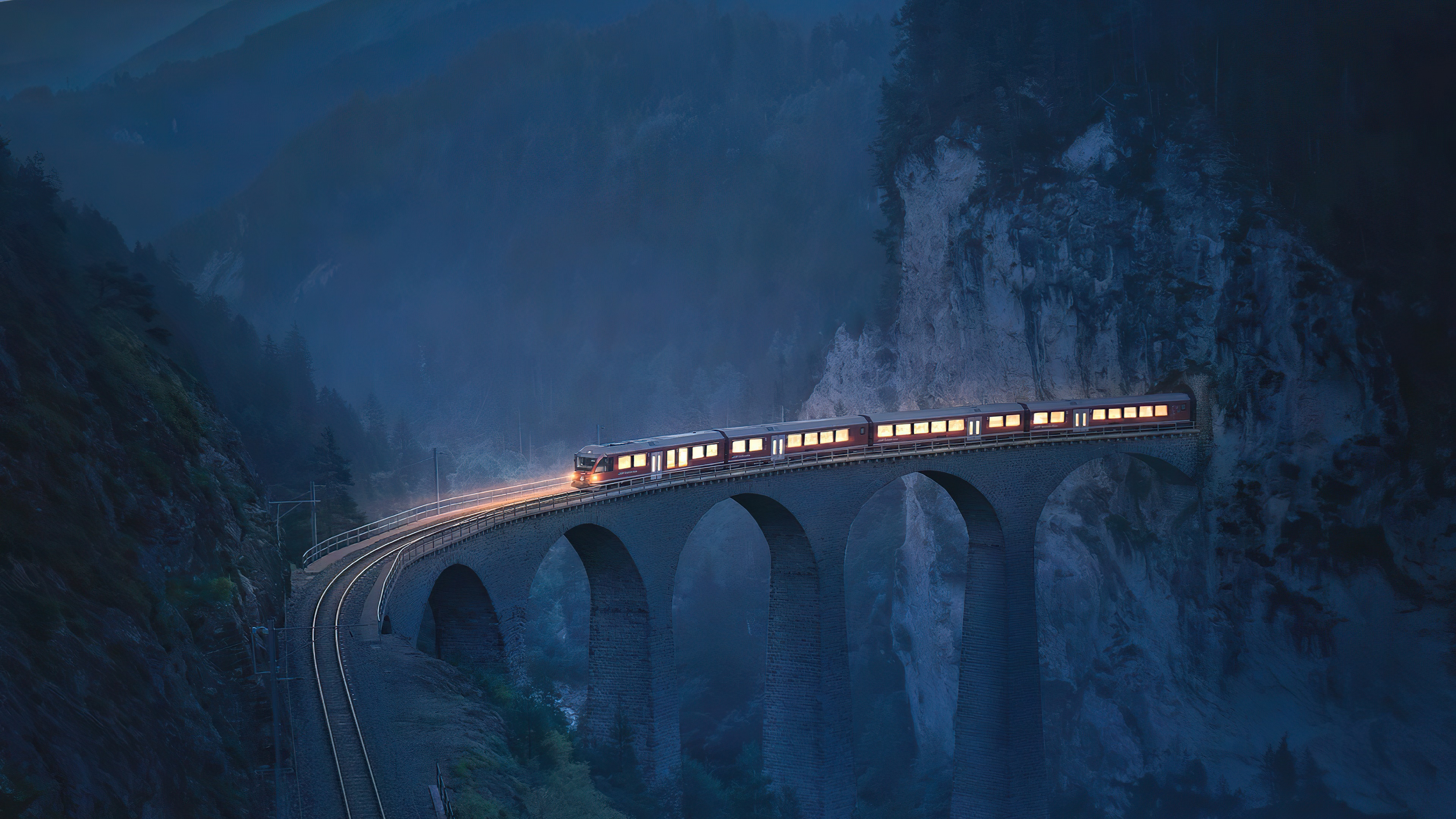 Train on a bridge in the mountains at dusk HD Wallpaper