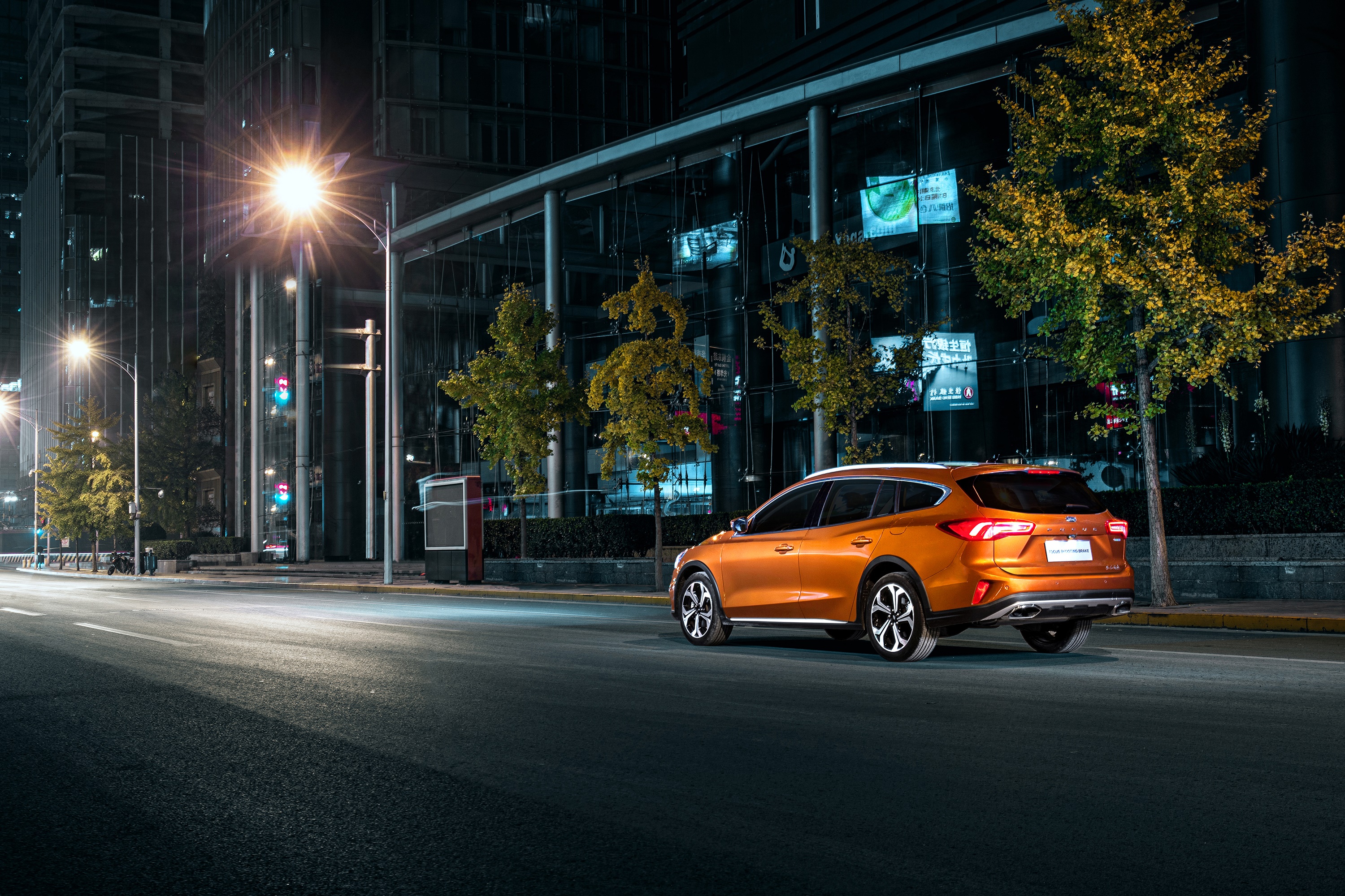 Ford Focus Shooting Brake on City Street at Night HD Wallpaper