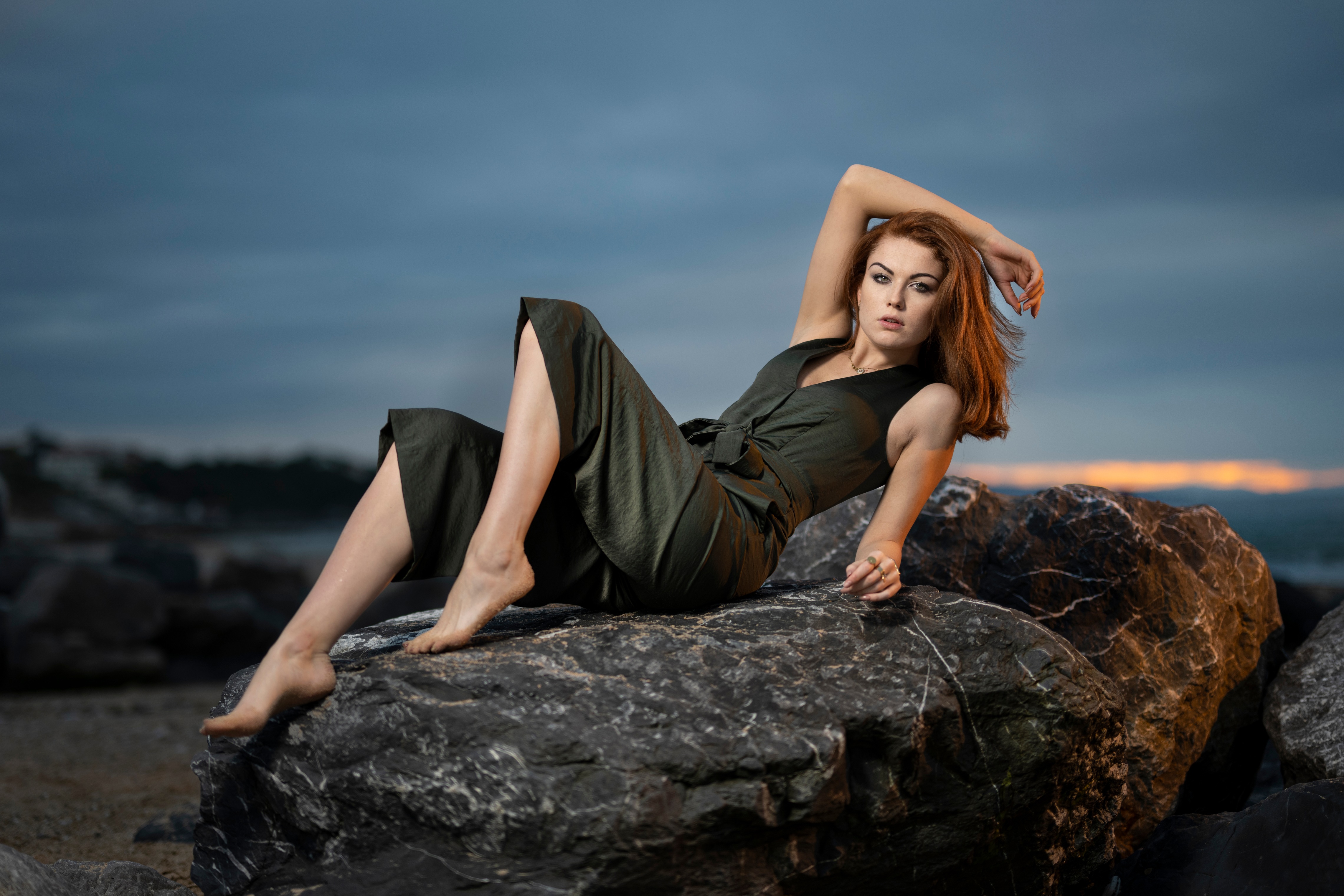 Redhead Model Posing on Rocks at Dusk 4K HD Wallpaper