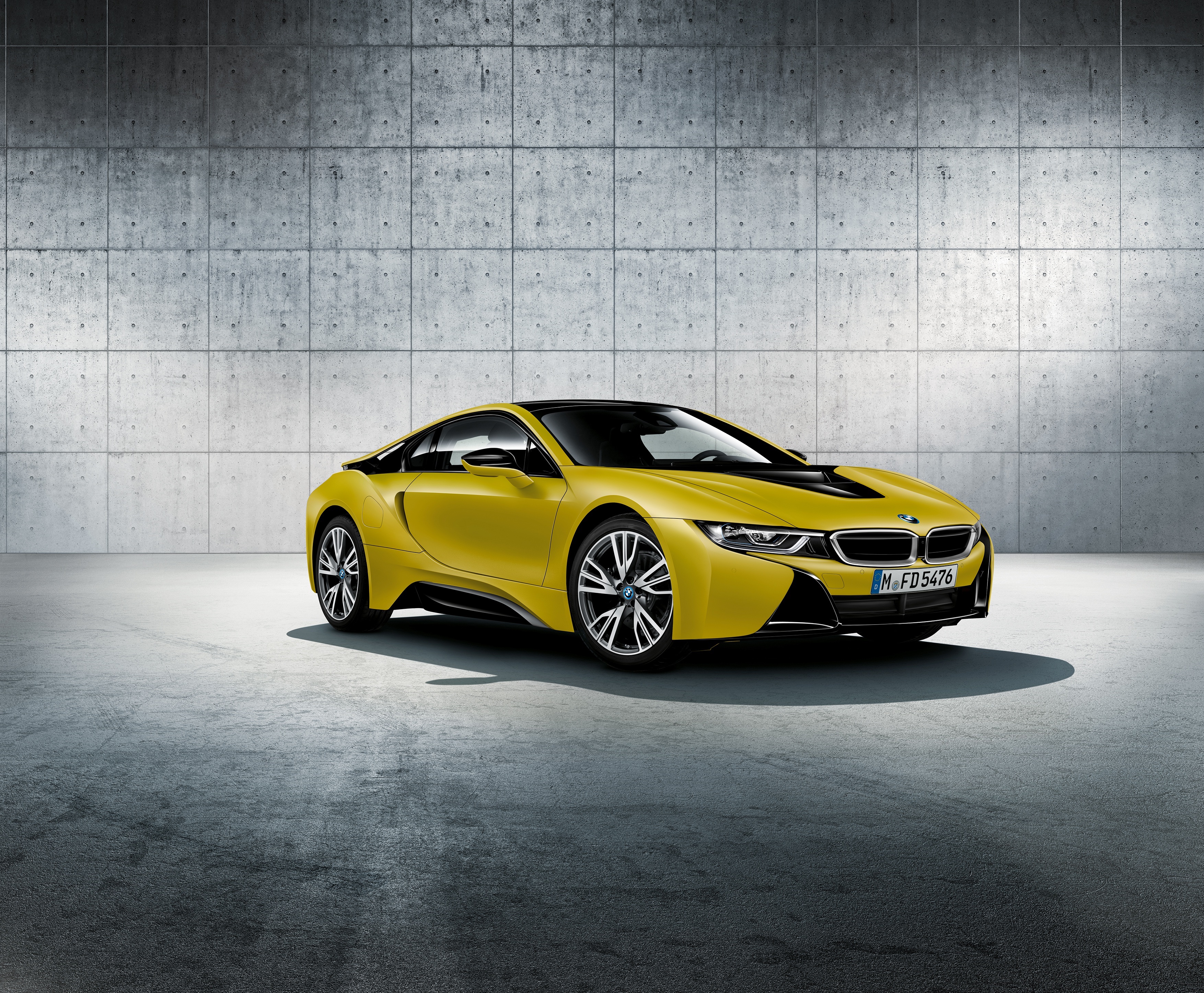 Yellow BMW i8 parked in a concrete garage HD Wallpaper