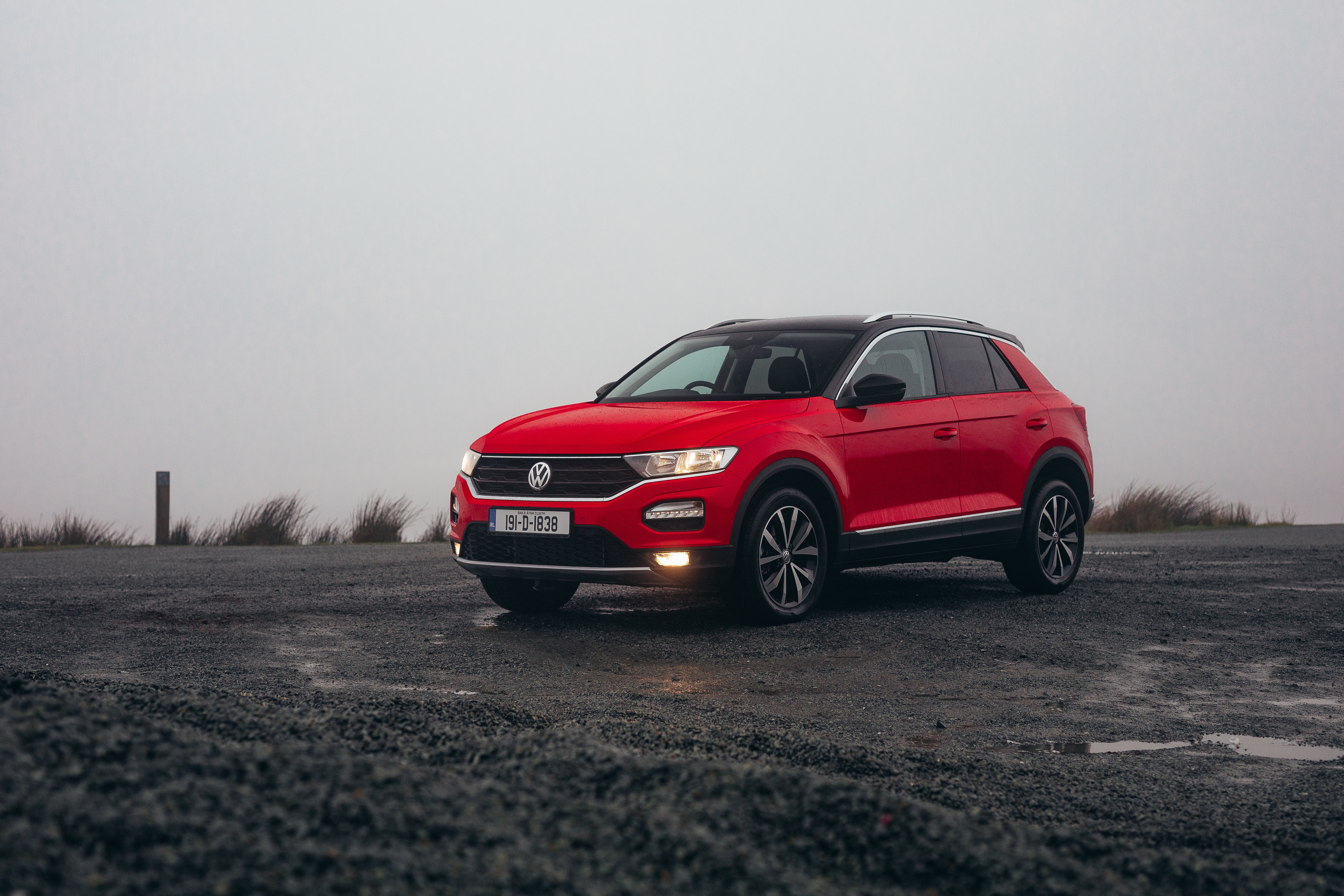 Red Volkswagen T-Roc SUV on a cloudy day HD Wallpaper