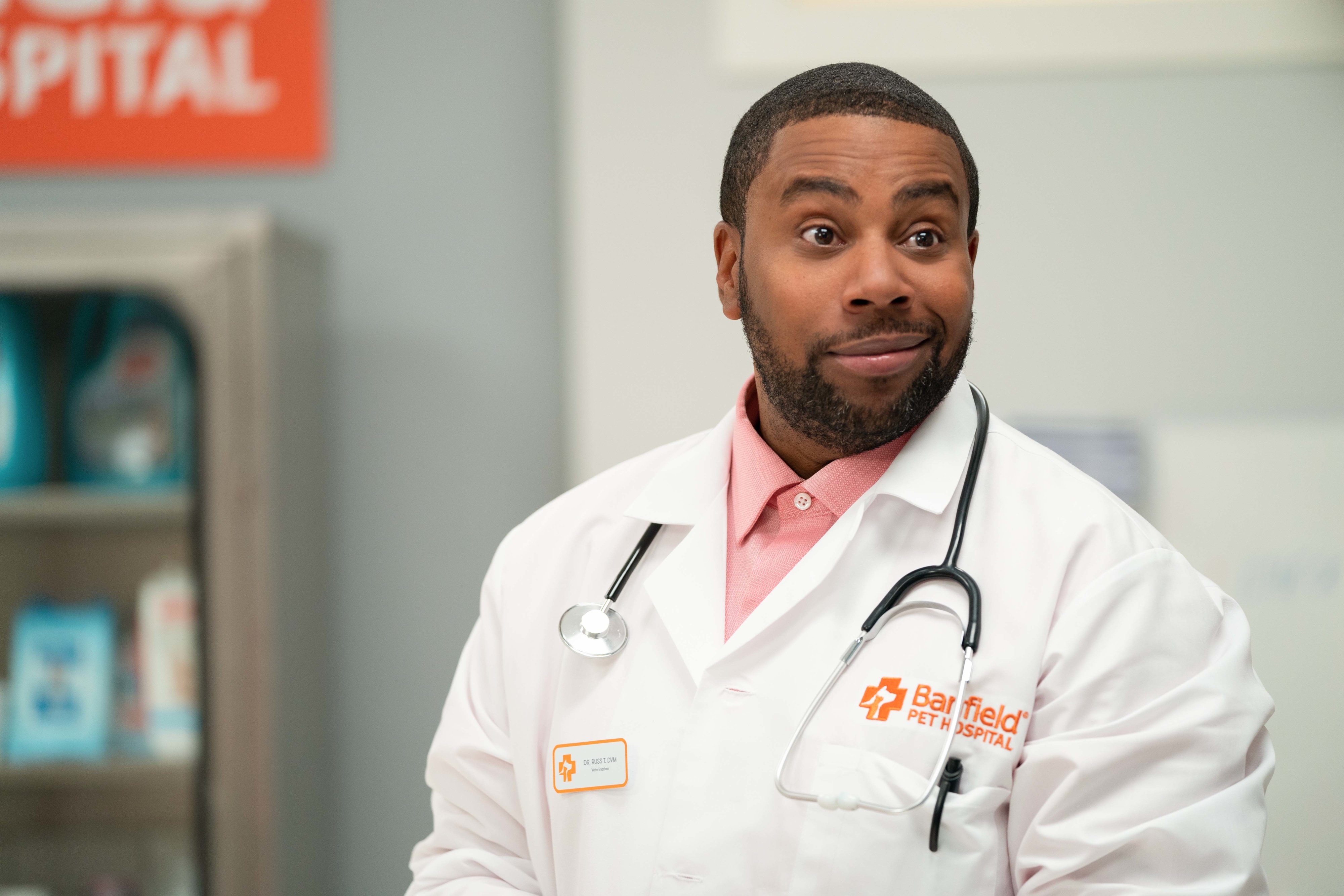 Man in a doctor's coat at a pet hospital HD Wallpaper