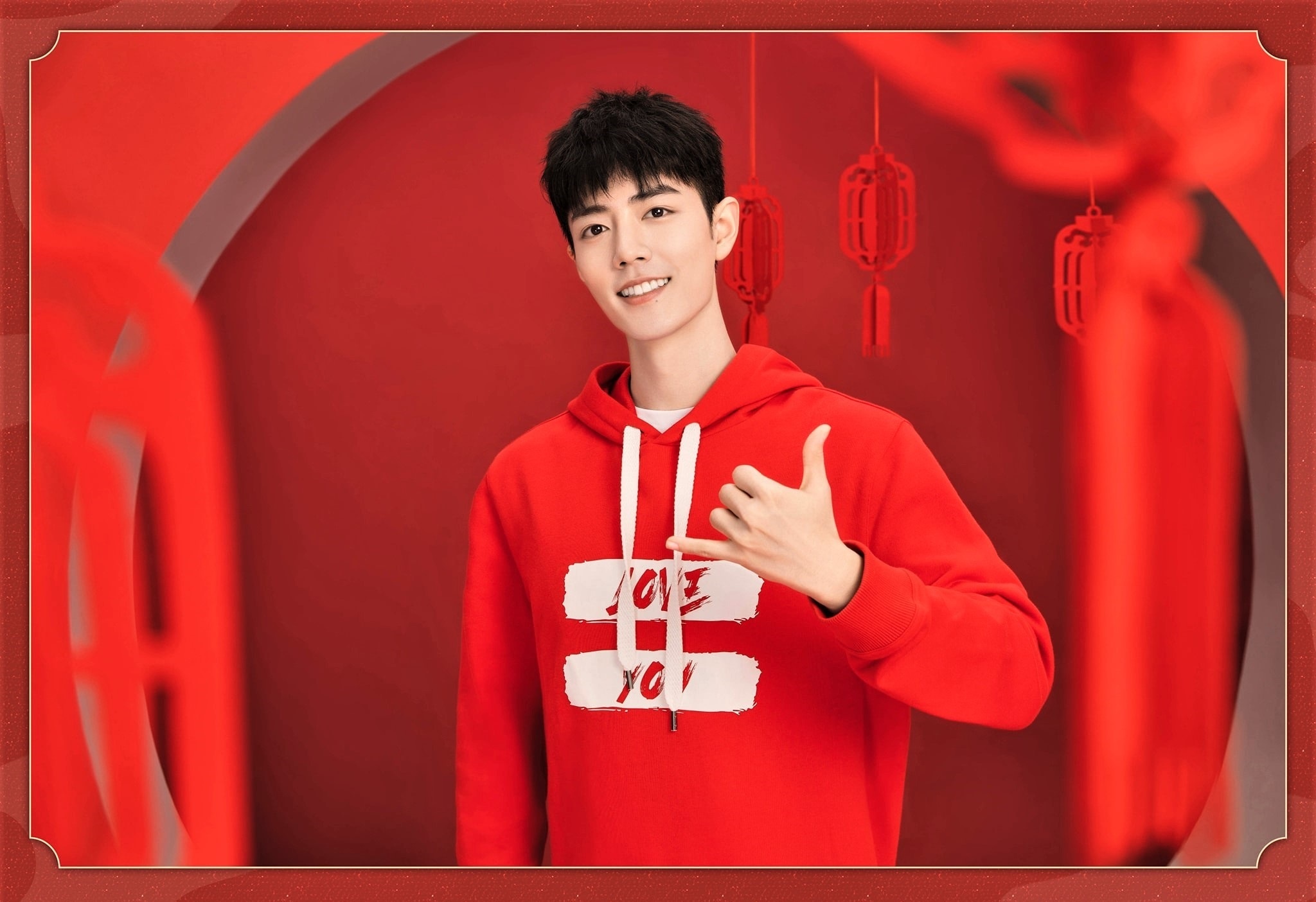 Xiao Zhan wearing a red hoodie HD Wallpaper
