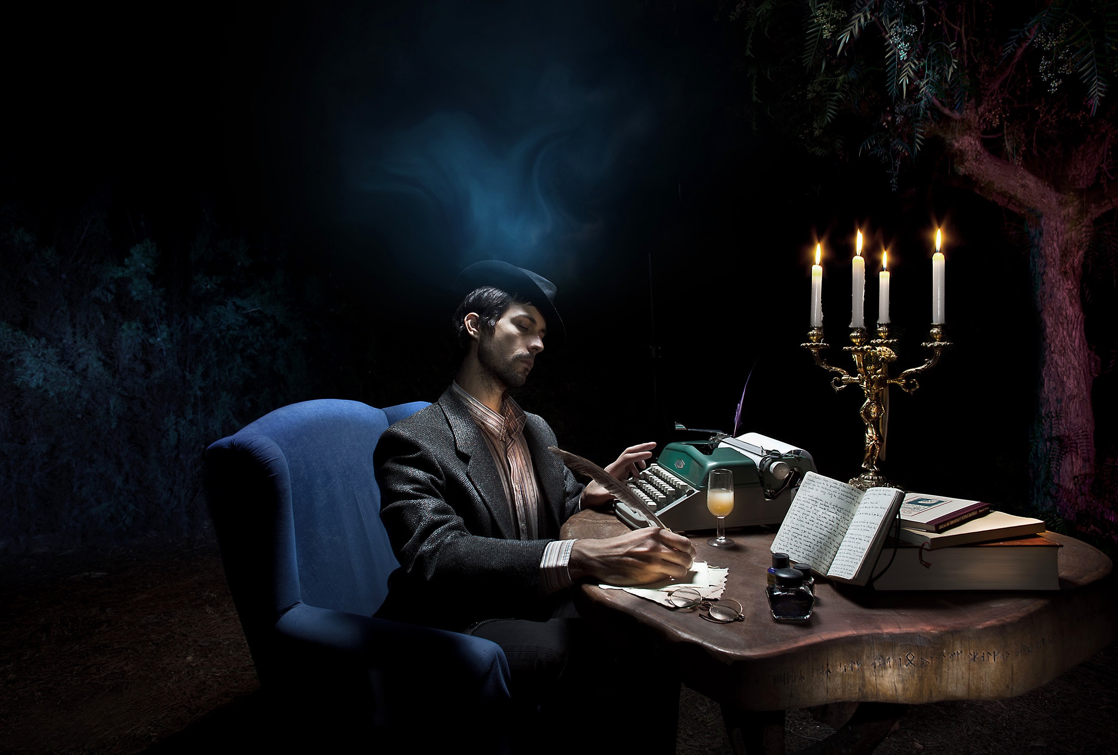 Man writing at a desk with a typewriter HD Wallpaper