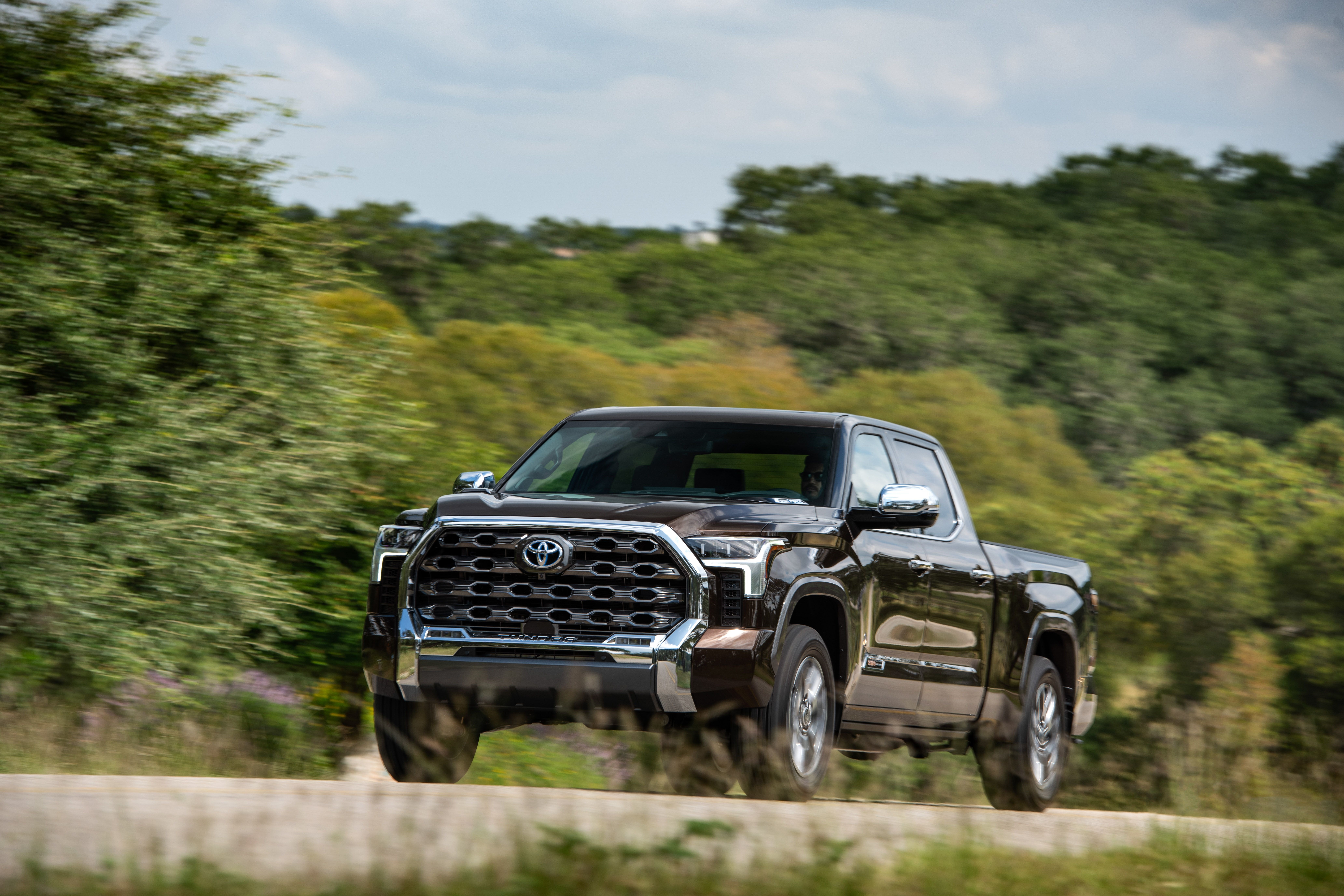 Brown Toyota Tundra CrewMax 1794 Edition driving HD Wallpaper