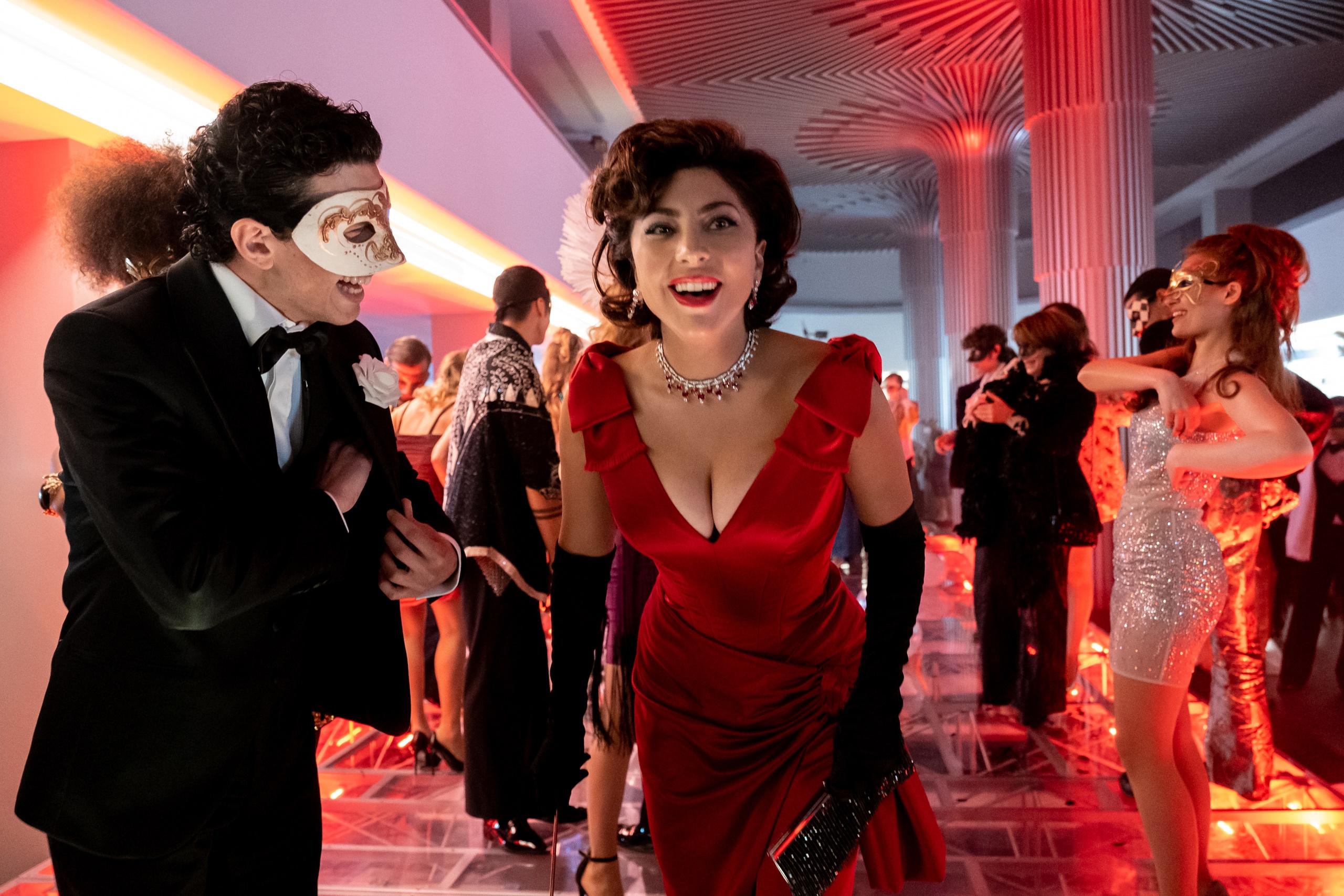 Lady Gaga and man in mask at party HD Wallpaper