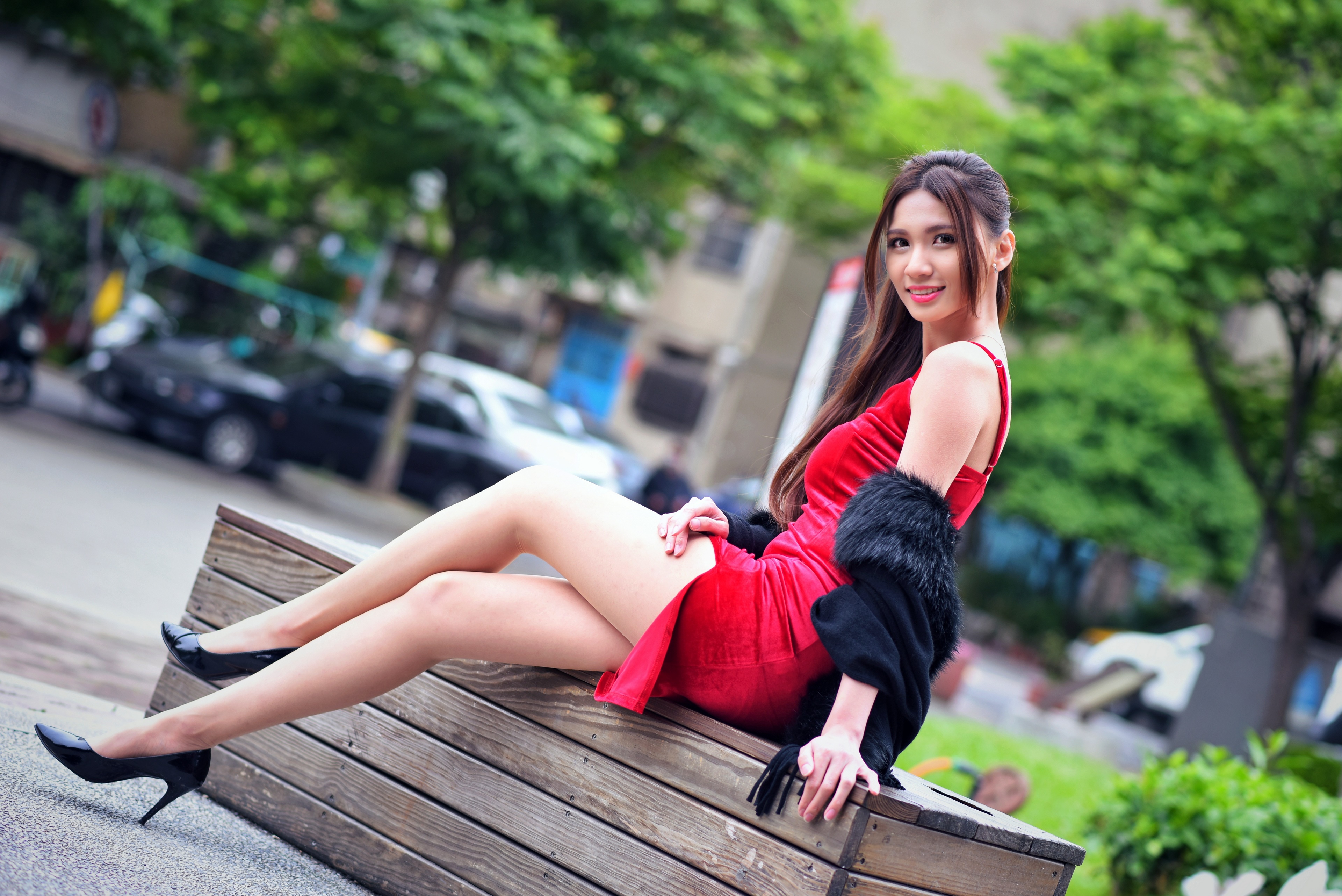 Asian woman in red dress sitting on bench HD Wallpaper