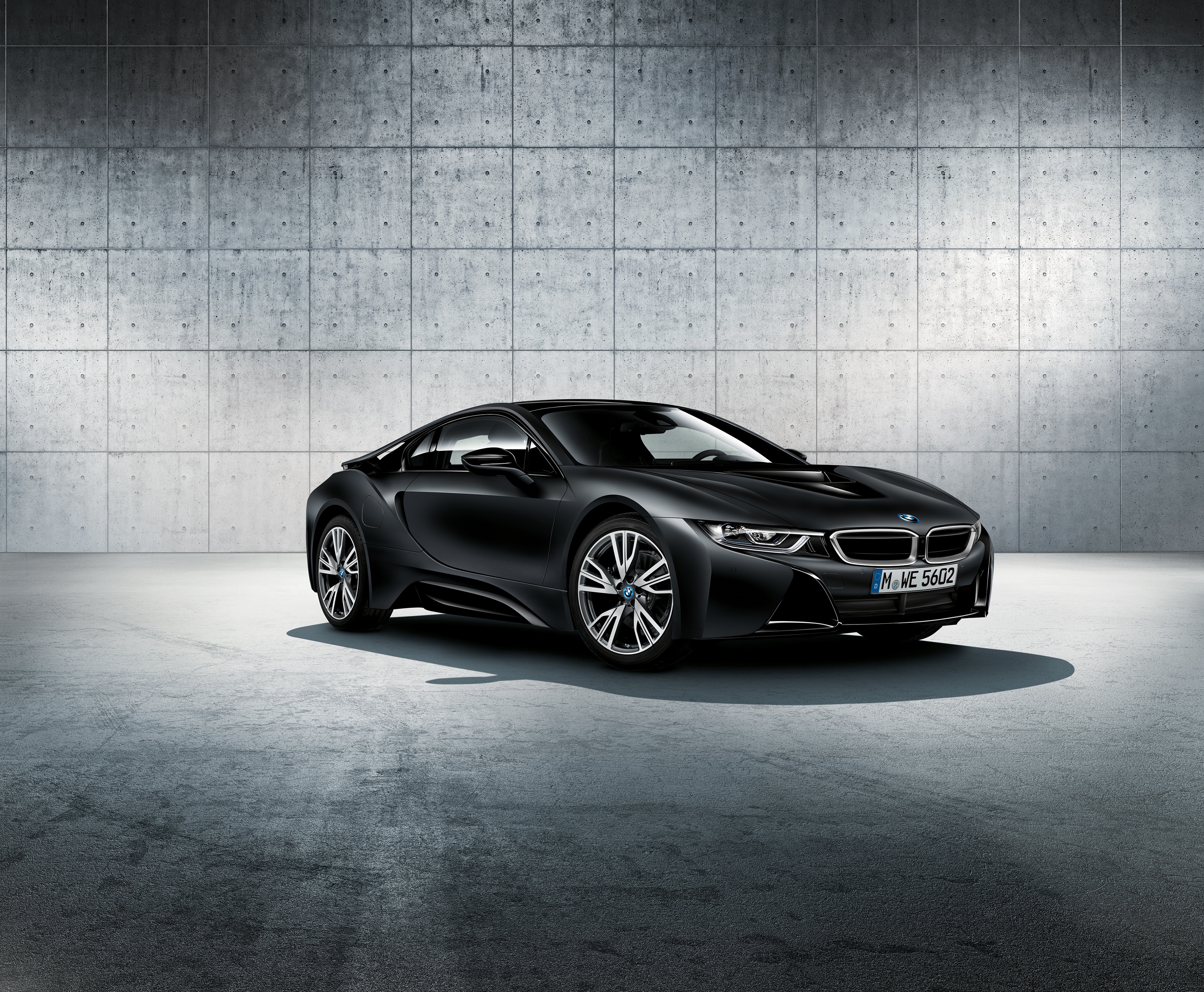 Black BMW i8 parked in front of concrete wall HD Wallpaper