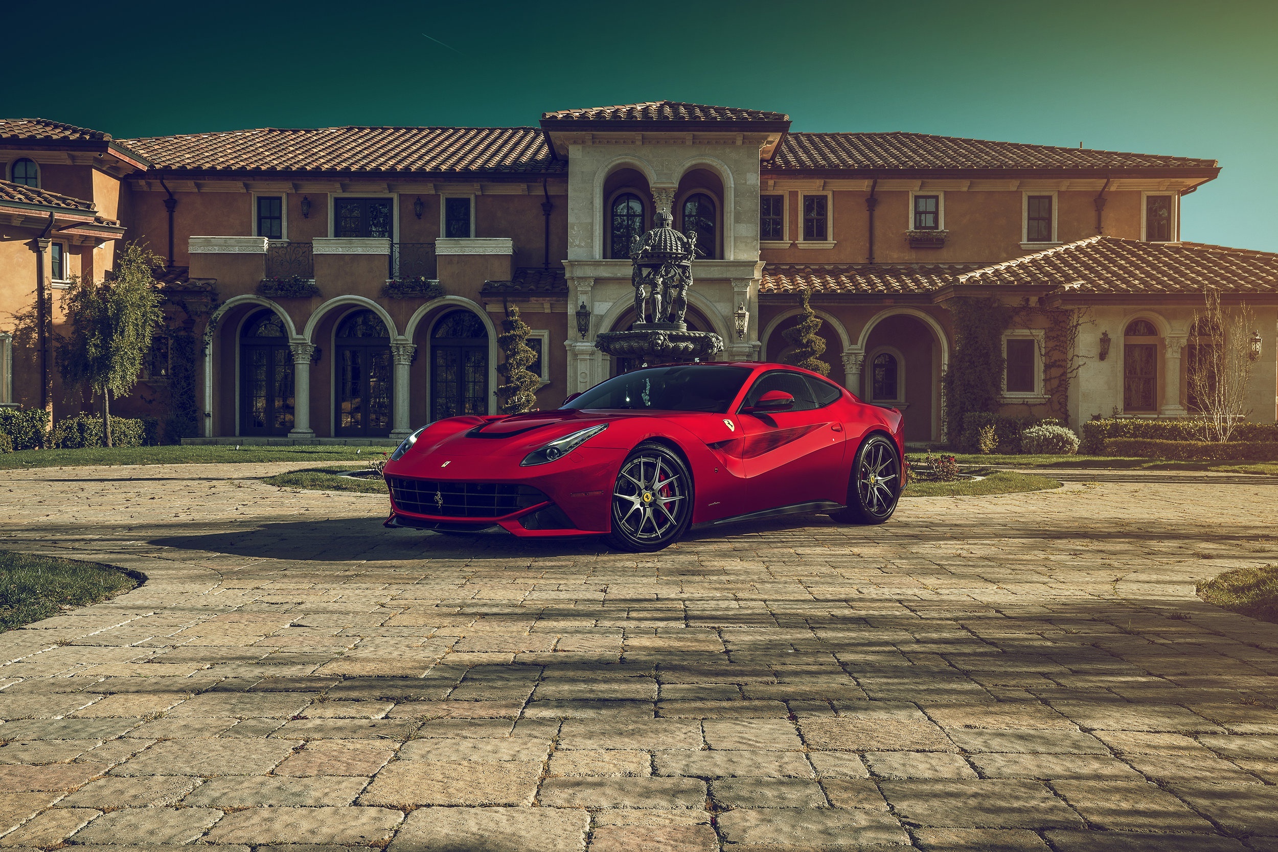 Red Ferrari F12berlinetta parked in front of a mansion HD Wallpaper