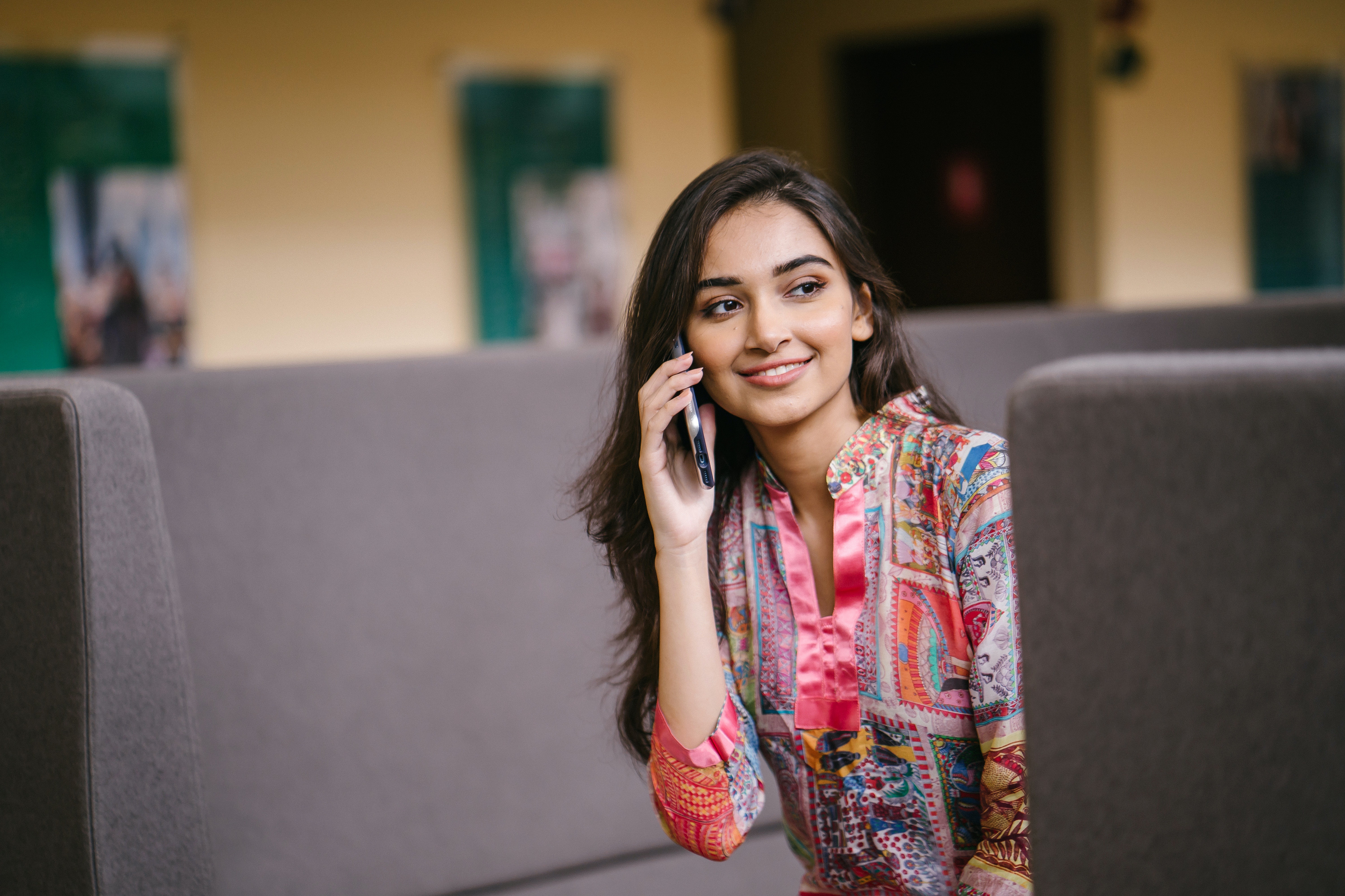 Brunette woman talking on a cell phone HD Wallpaper