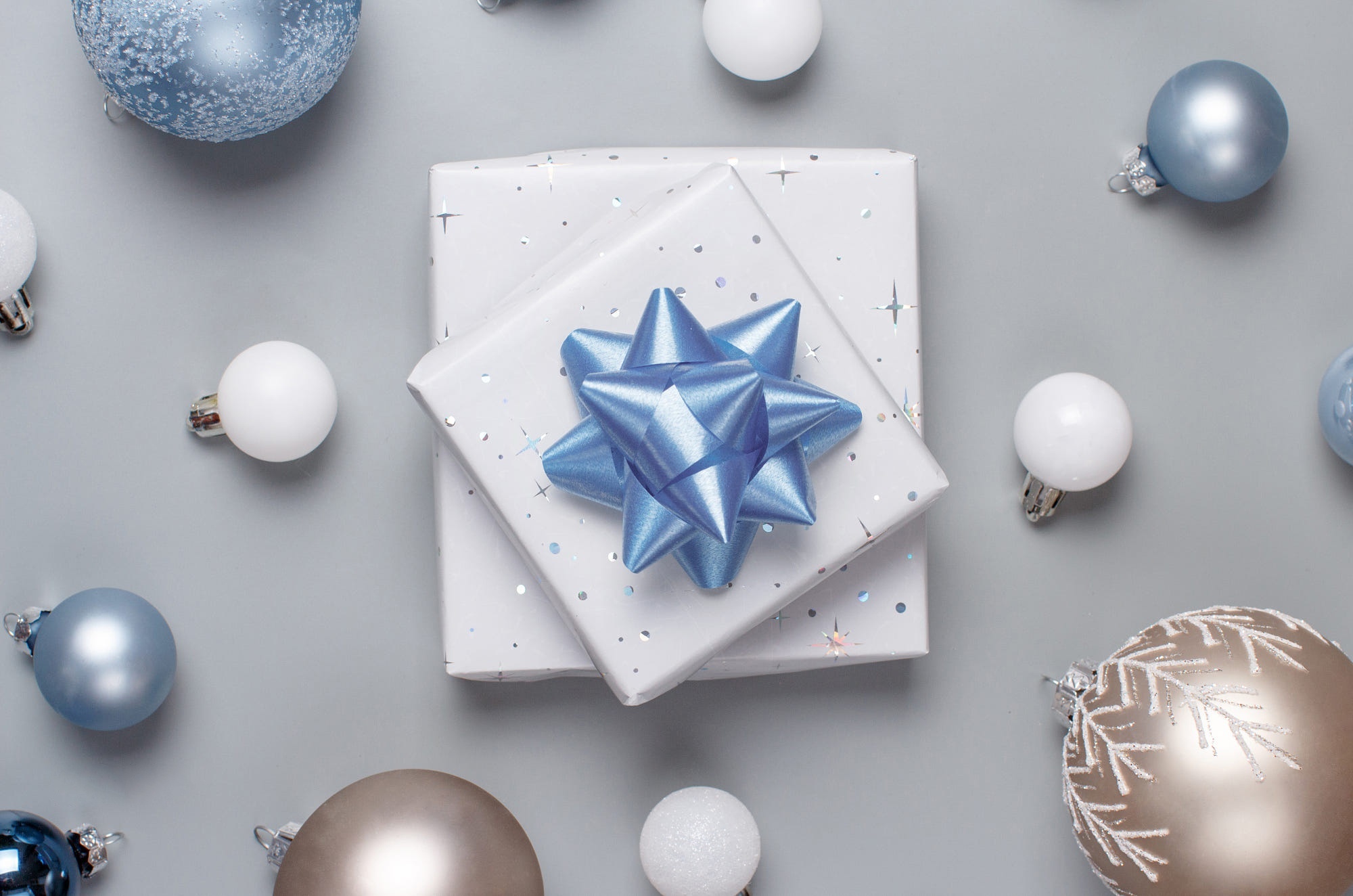 Christmas gifts and ornaments on a gray background HD Wallpaper