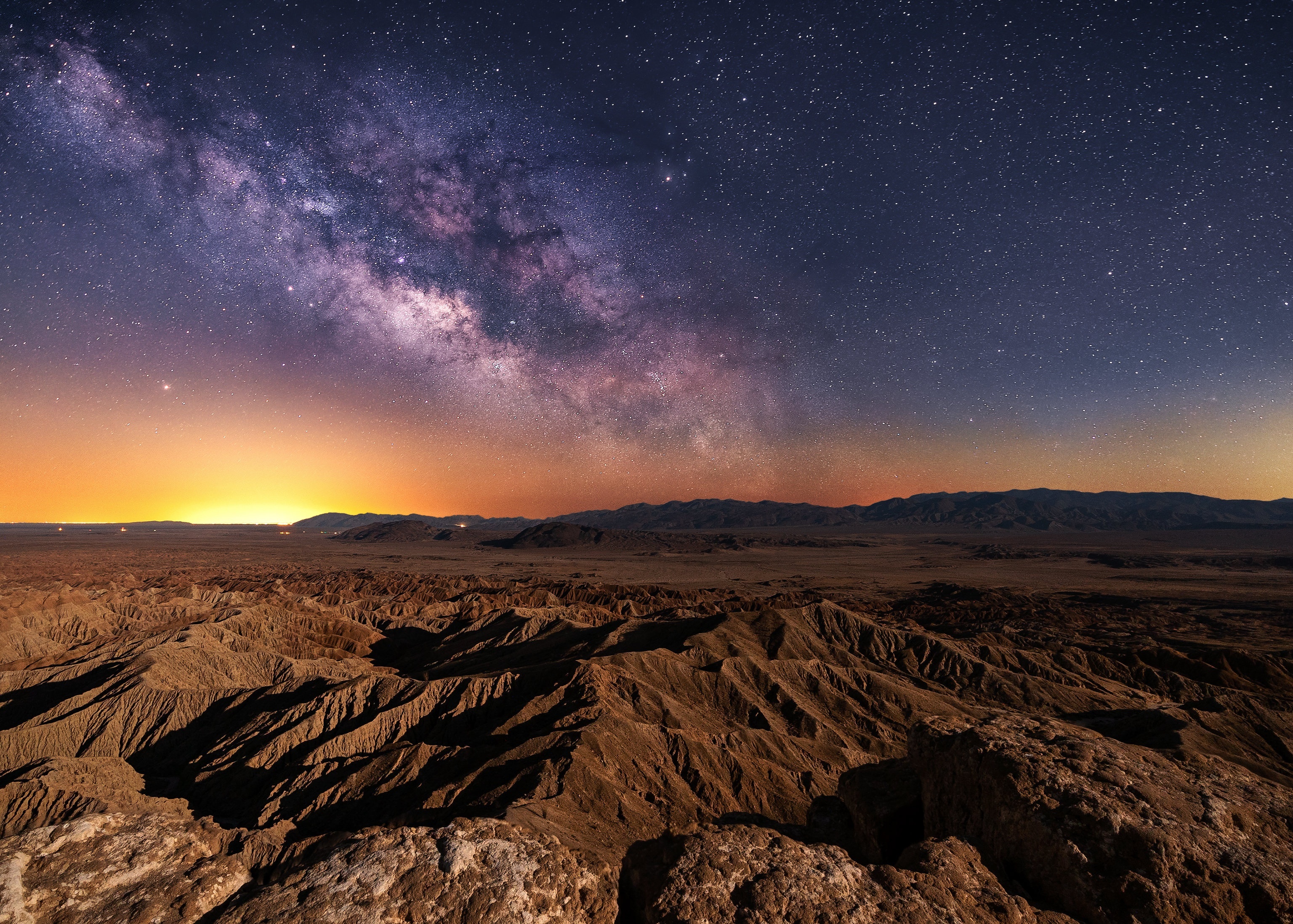 Milky Way over desert badlands at night HD Wallpaper