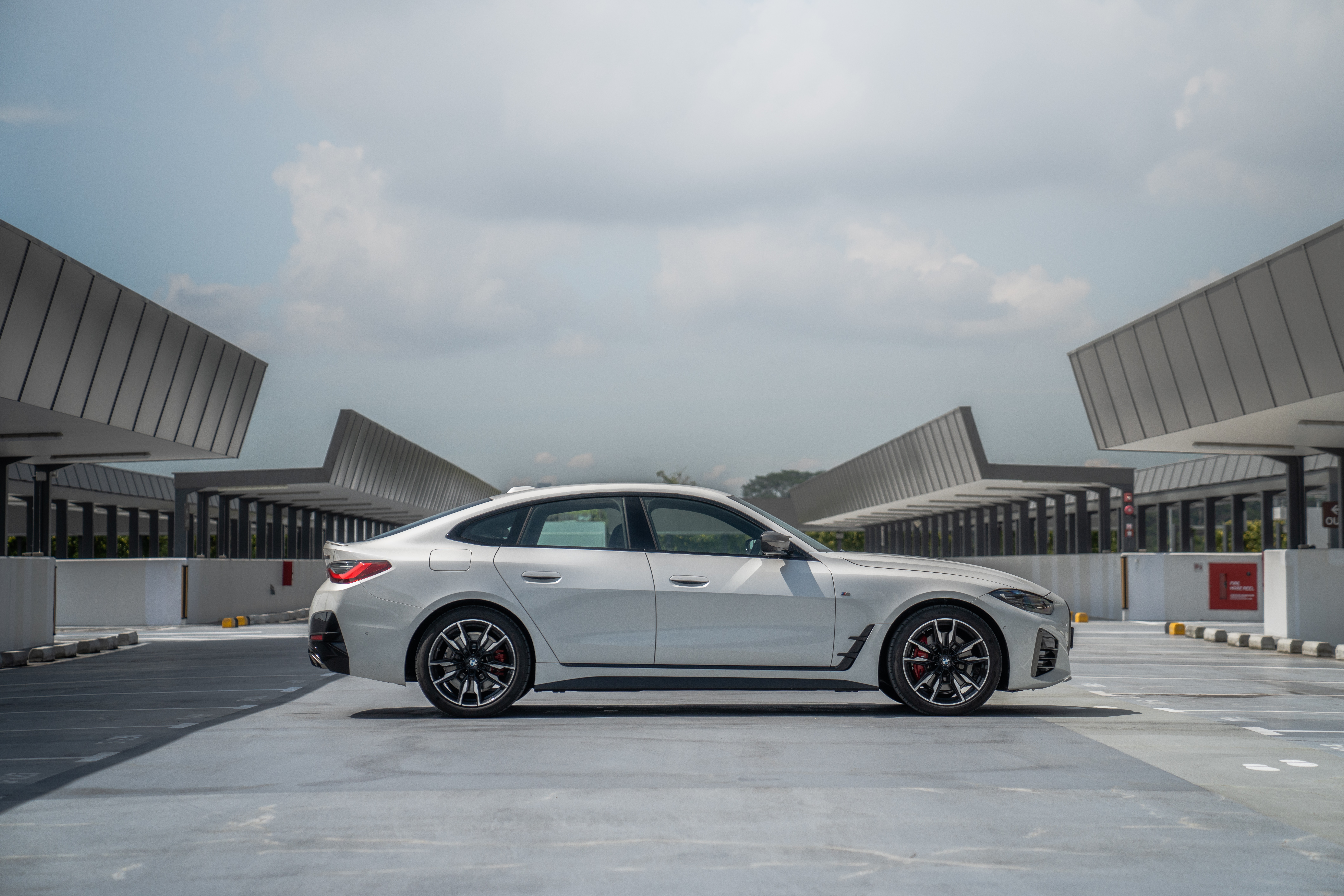 White BMW M440i xDrive Gran Coupé parked outdoors HD Wallpaper