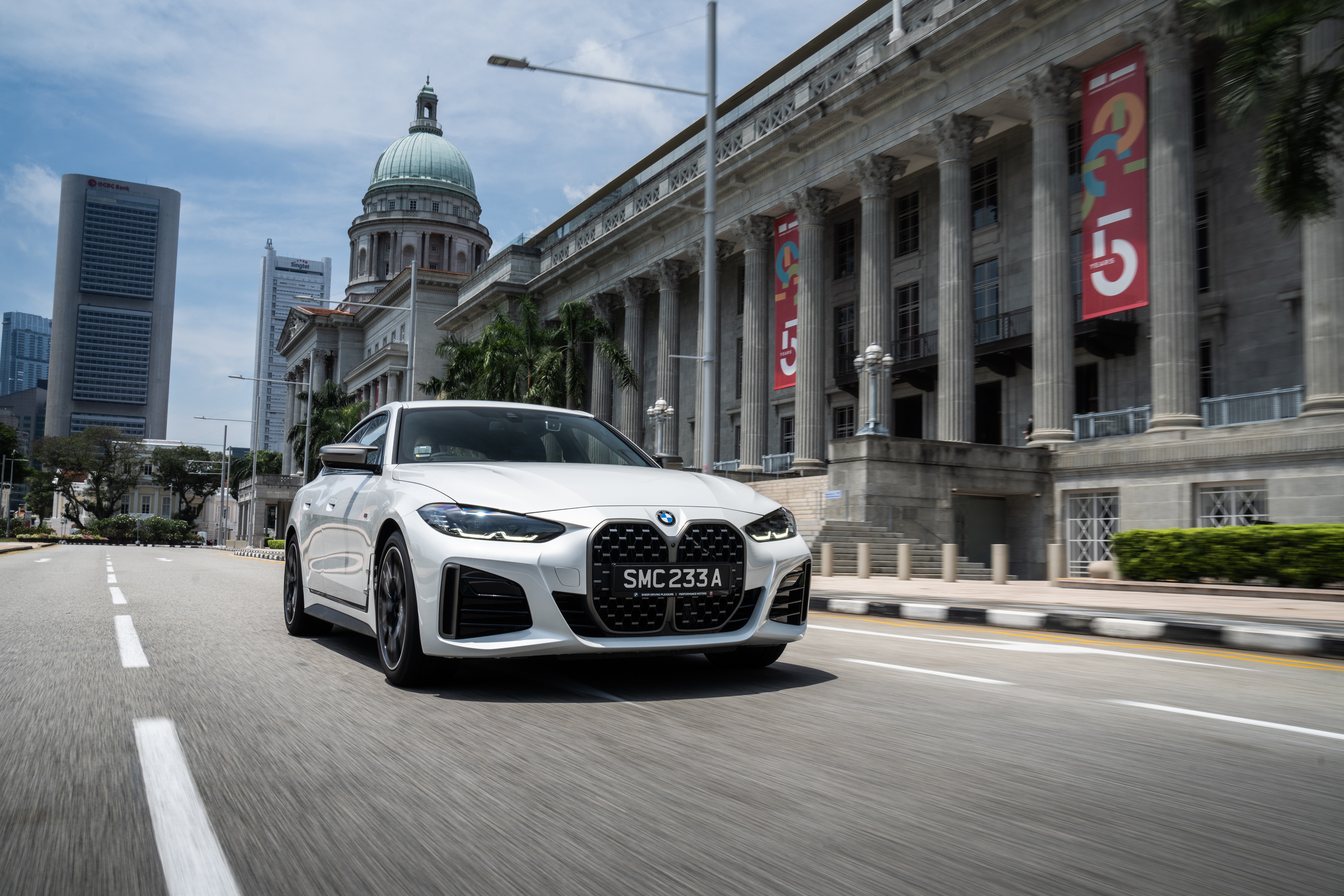 White BMW M440i xDrive Gran Coupé driving in Singapore HD Wallpaper