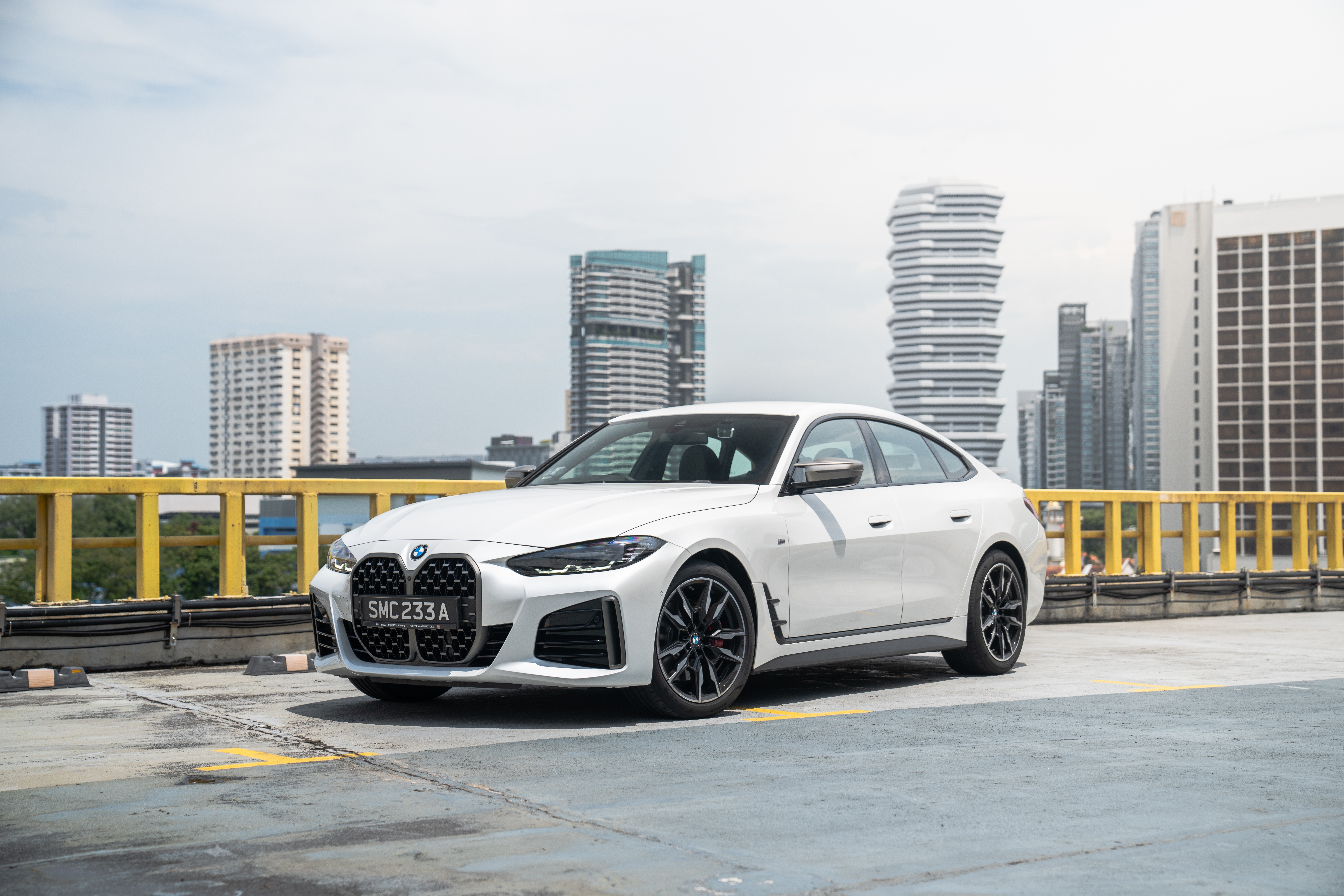 White BMW M440i xDrive Gran Coupé in city HD Wallpaper