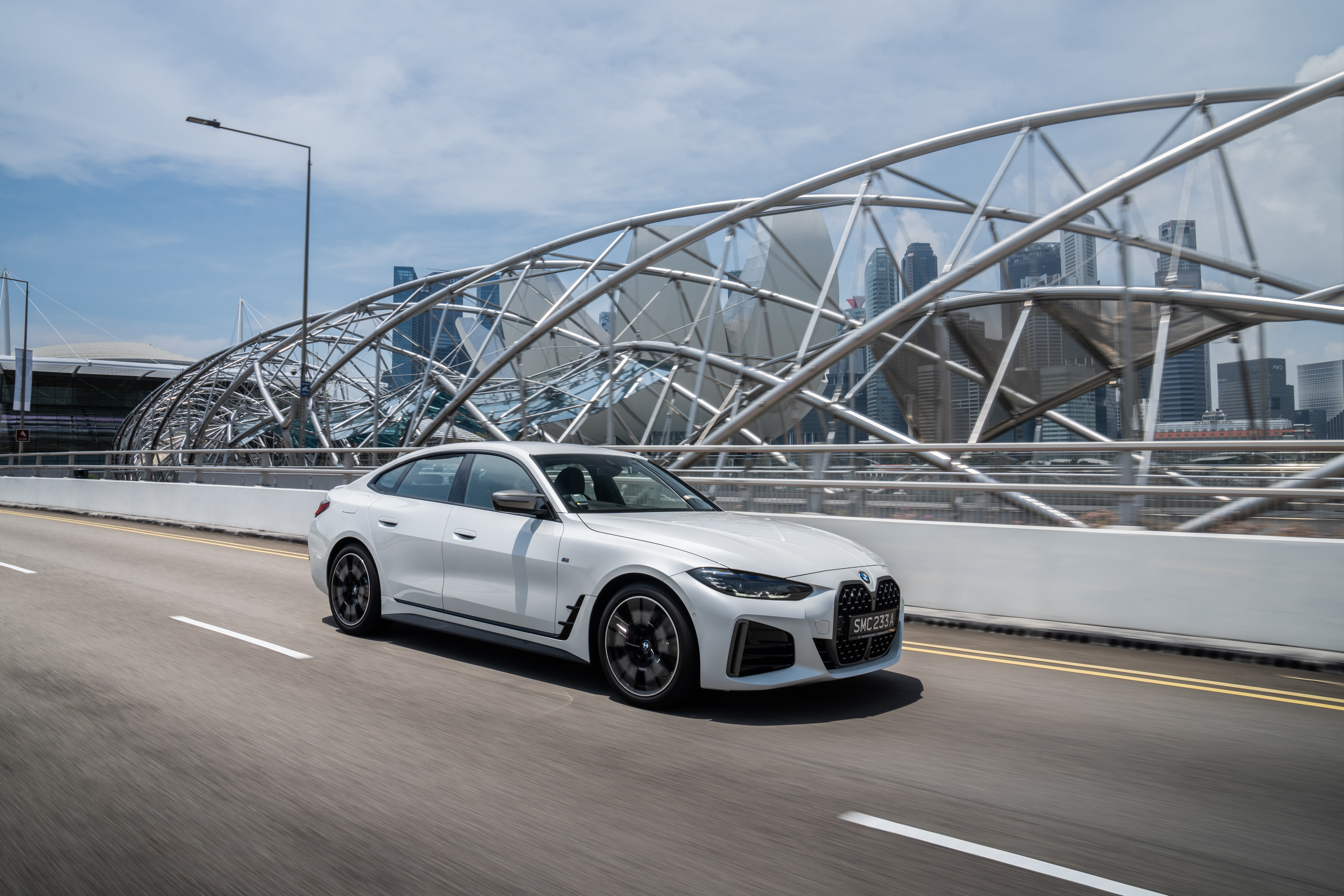 White BMW M440i xDrive Gran Coupé on a bridge HD Wallpaper