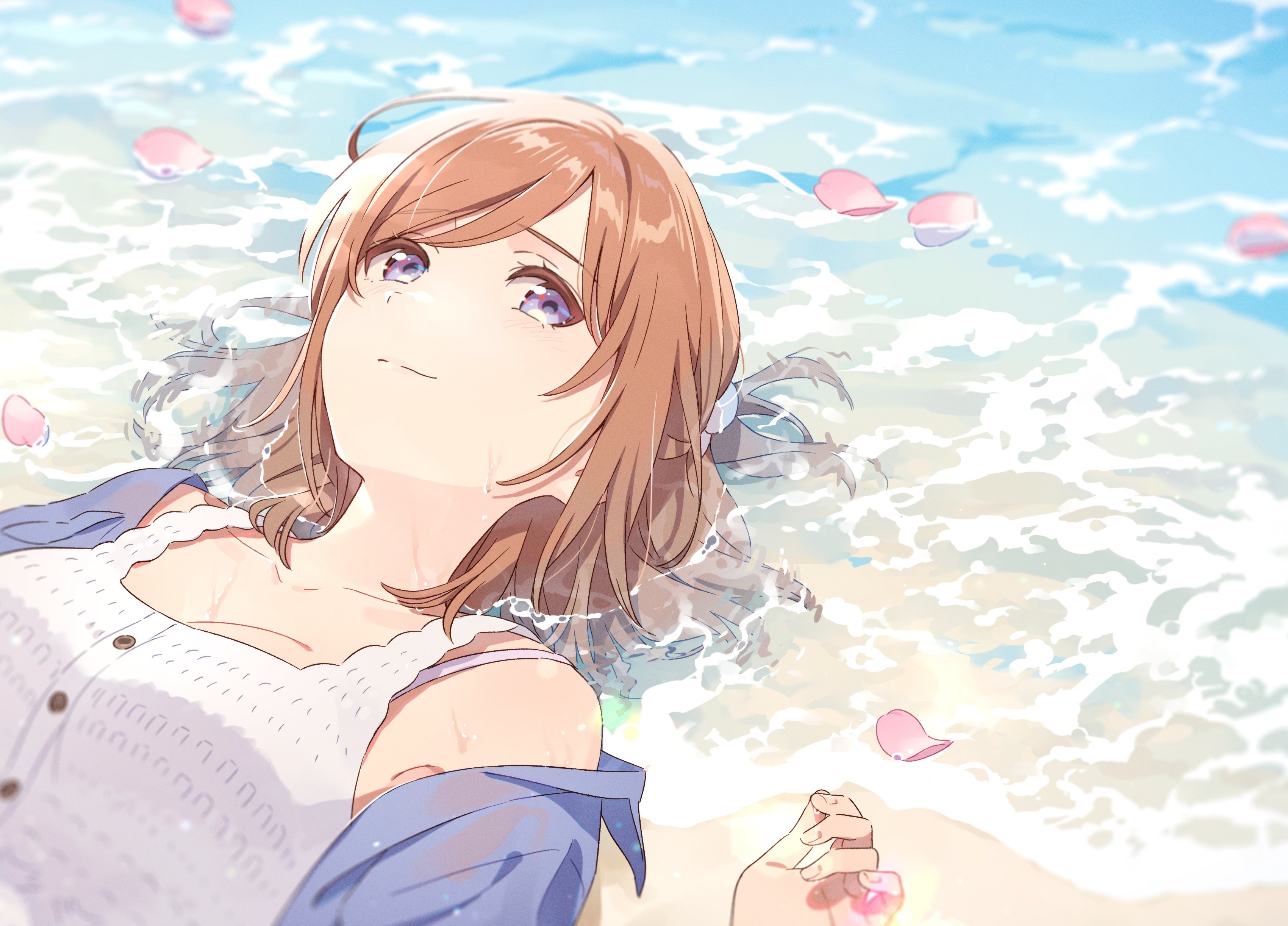 Girl lying in the ocean with petals HD Wallpaper