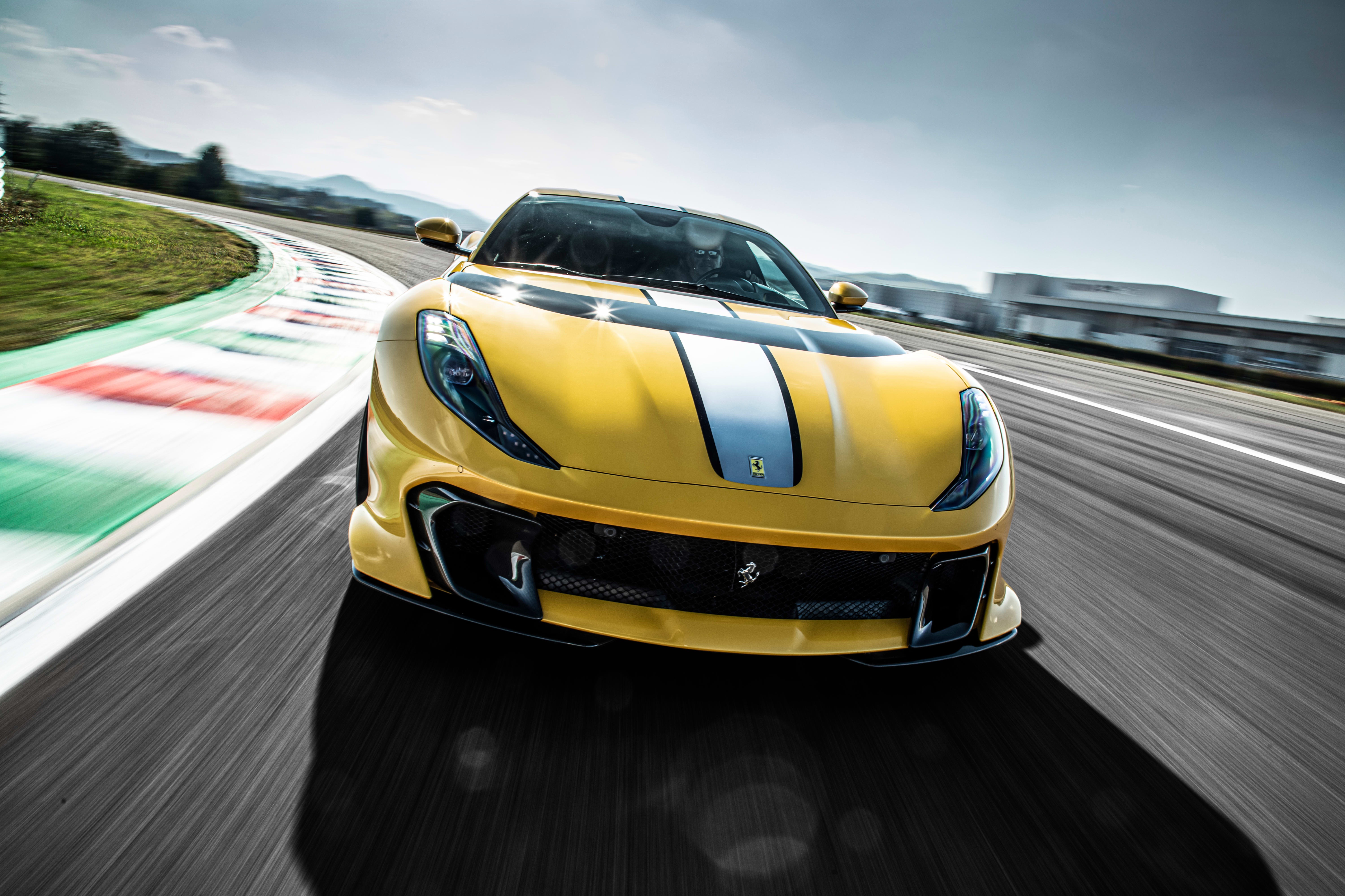 Yellow Ferrari 812 Competizione on a Race Track 4K HD Wallpaper