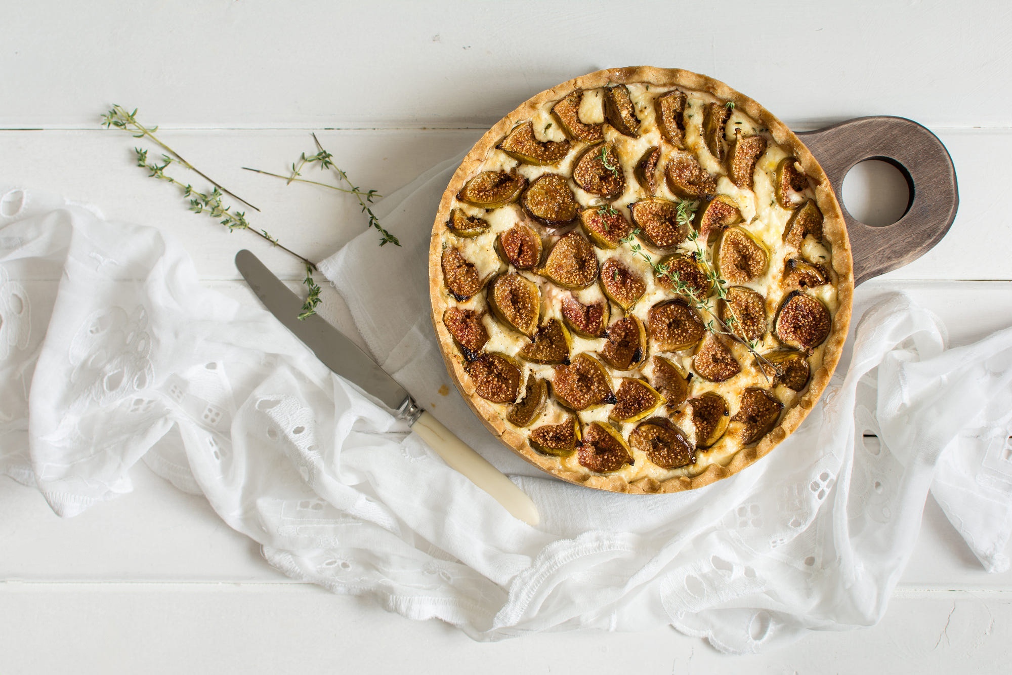 Fig and cheese tart on a wooden board HD Wallpaper