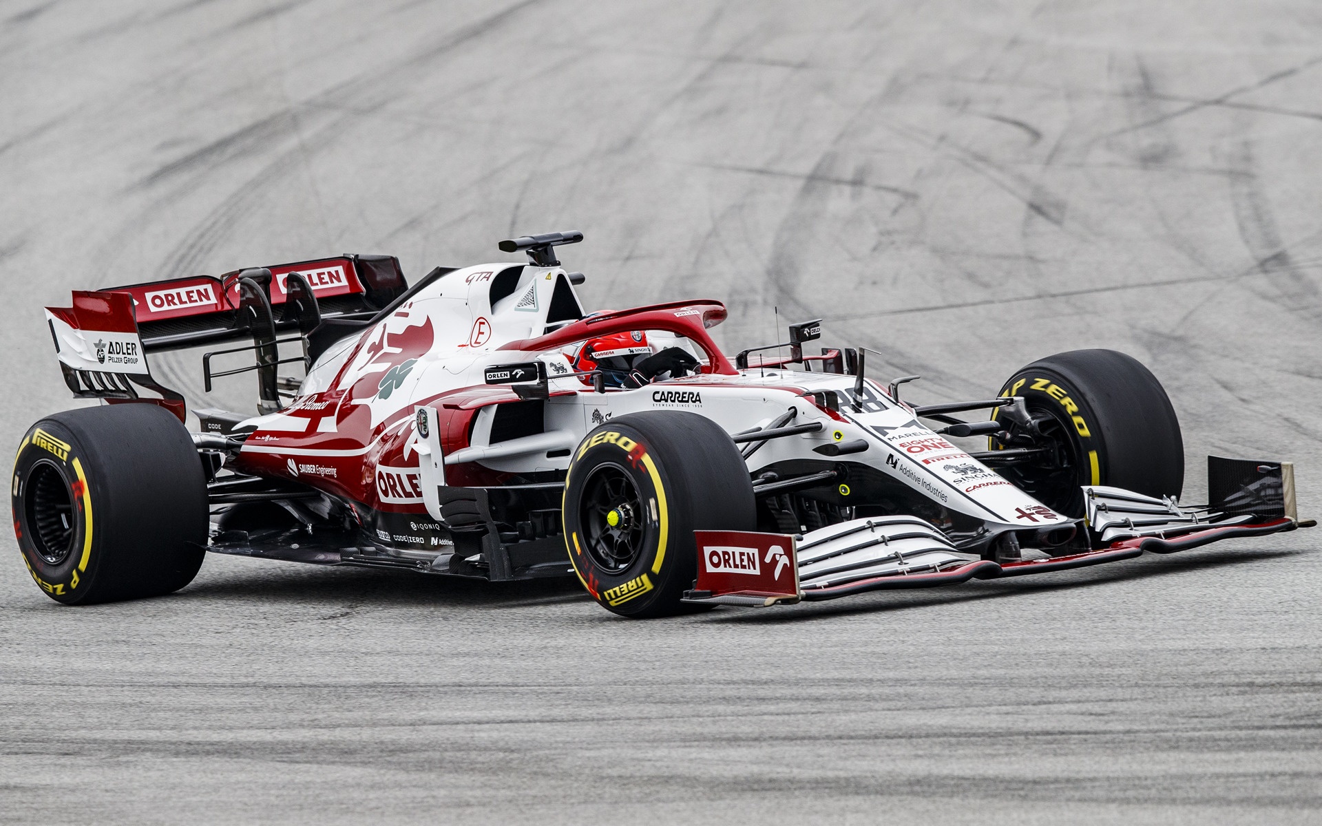 Alfa Romeo F1 car on a race track HD Wallpaper