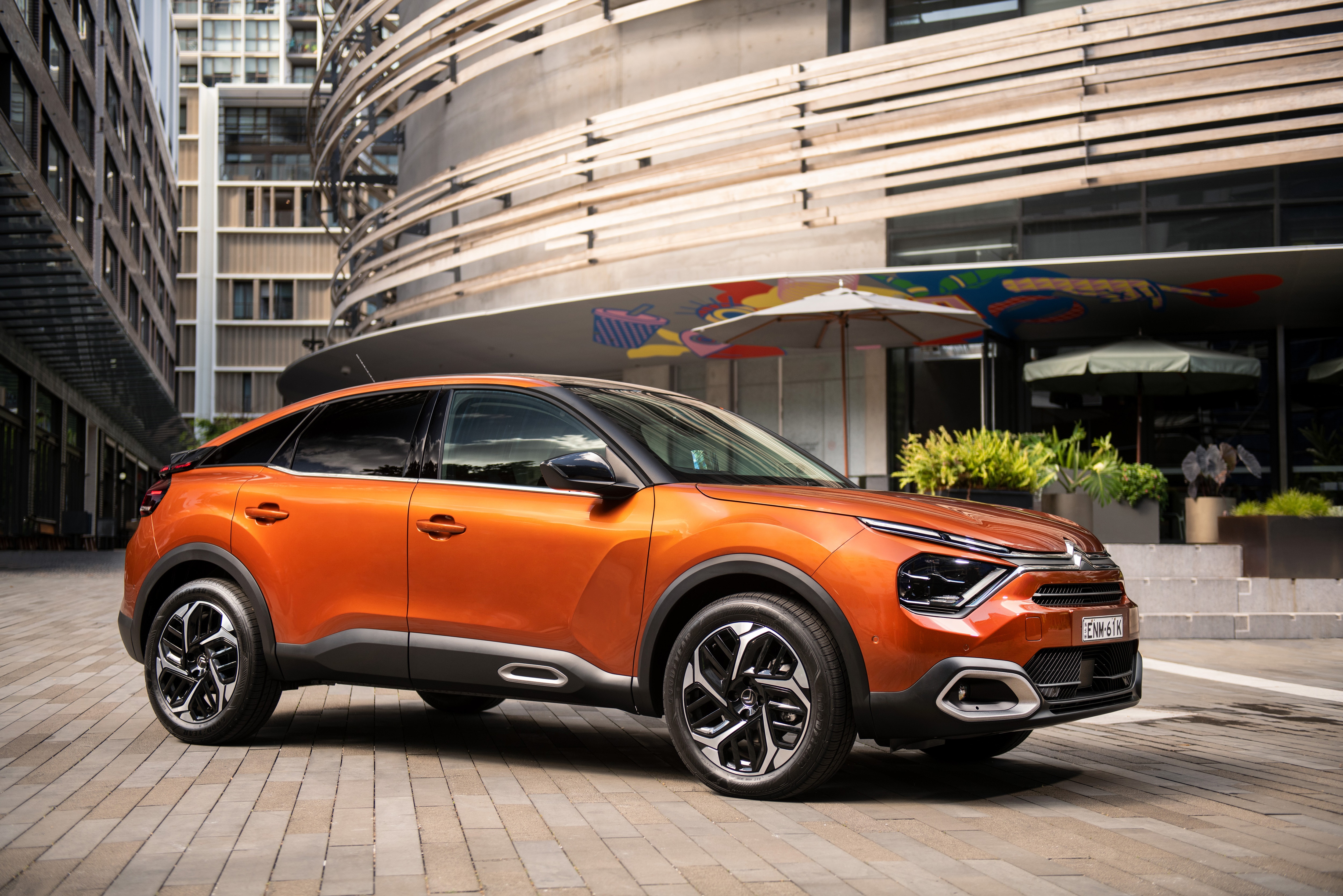 Orange Citroen C4 SUV parked on a city street HD Wallpaper