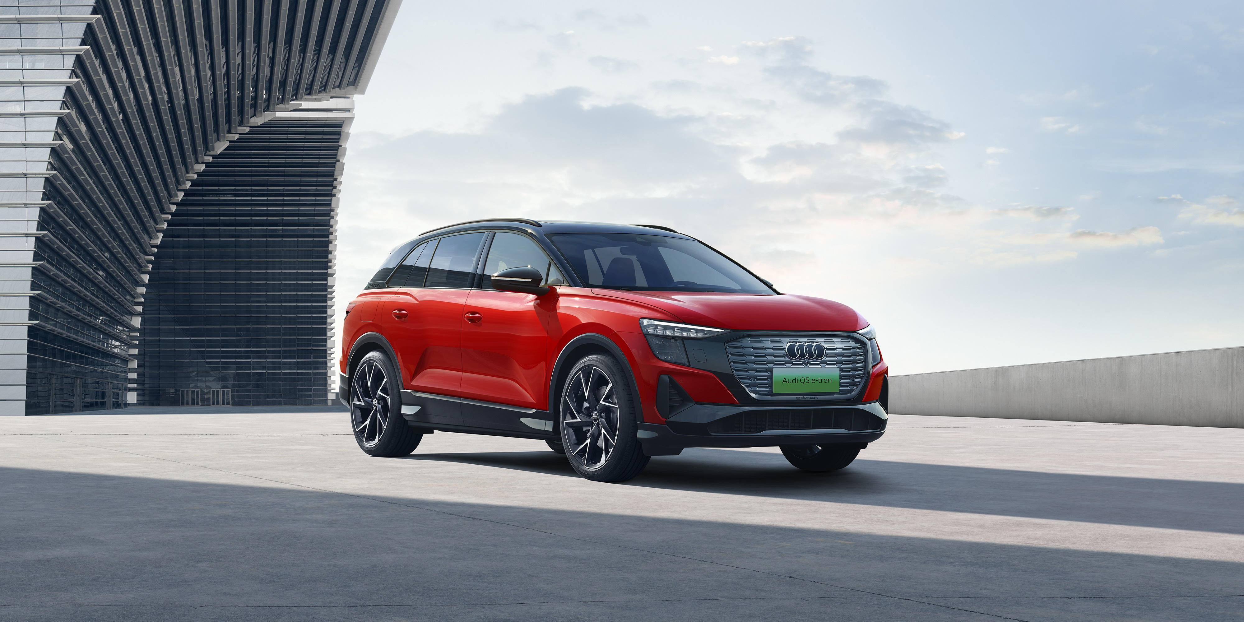 Red Audi Q5 50 E-tron Quattro electric SUV HD Wallpaper