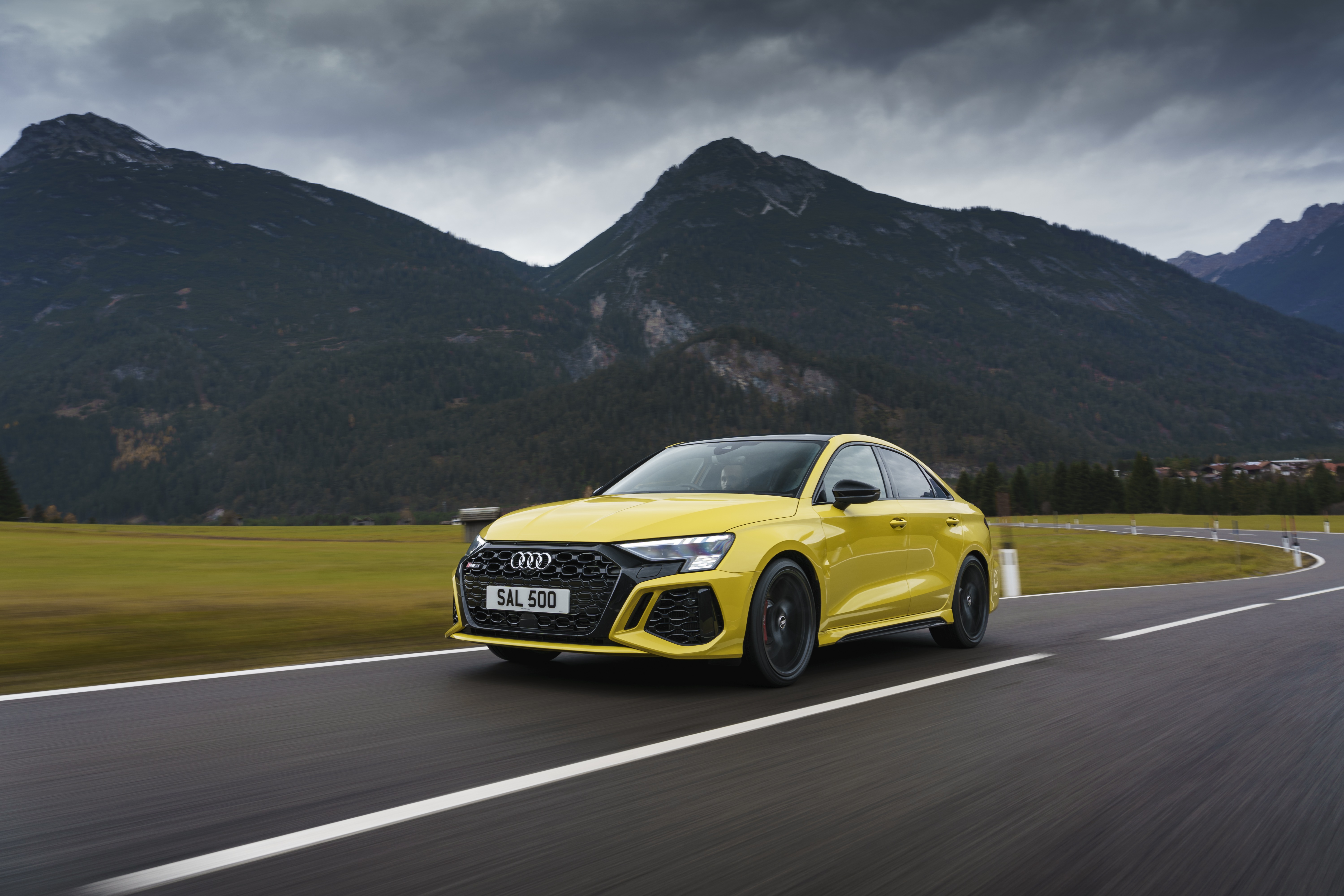 Yellow Audi RS3 Sedan 4K driving on a mountain road HD Wallpaper