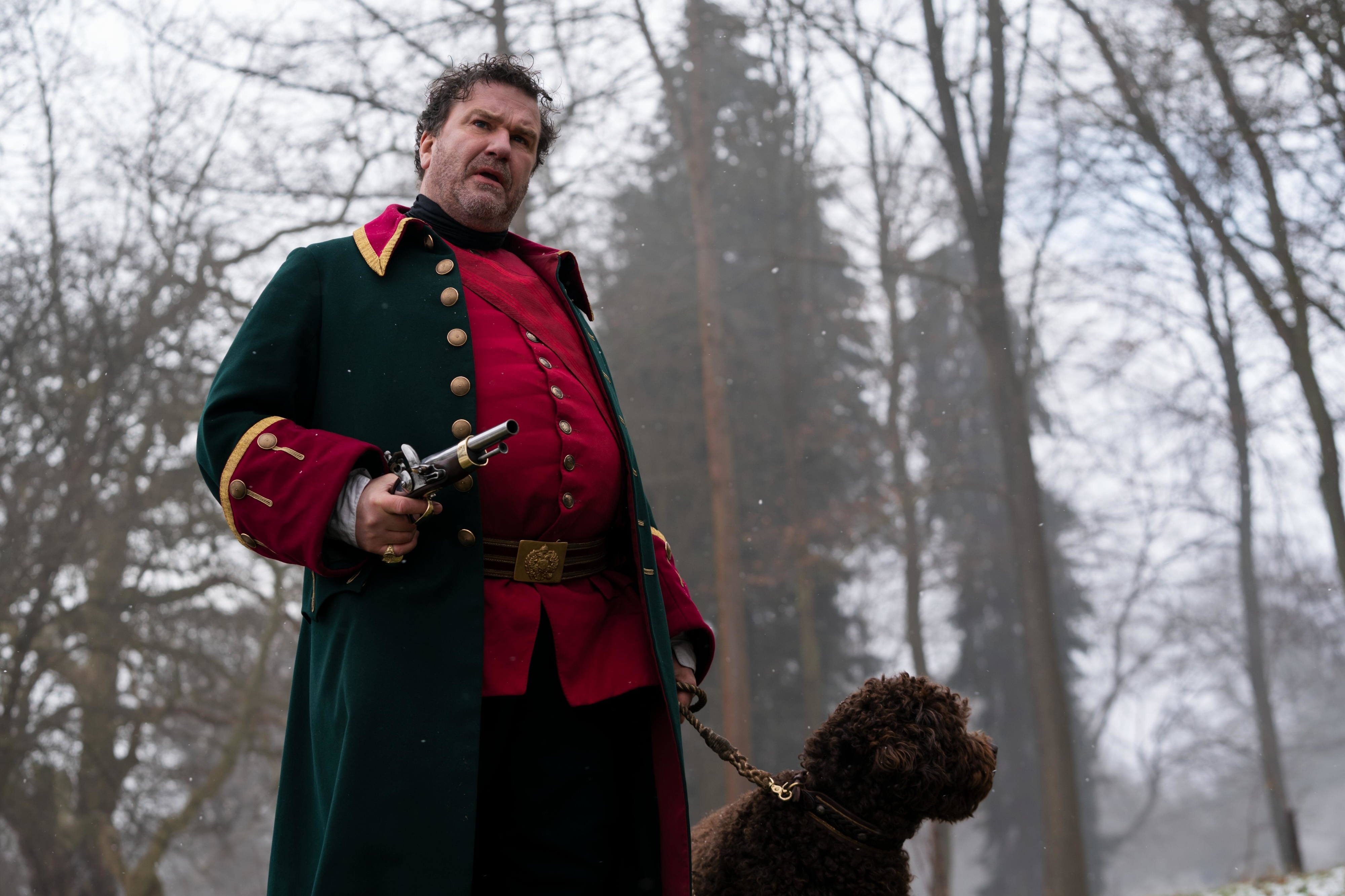 Man in historical costume with pistol and dog HD Wallpaper