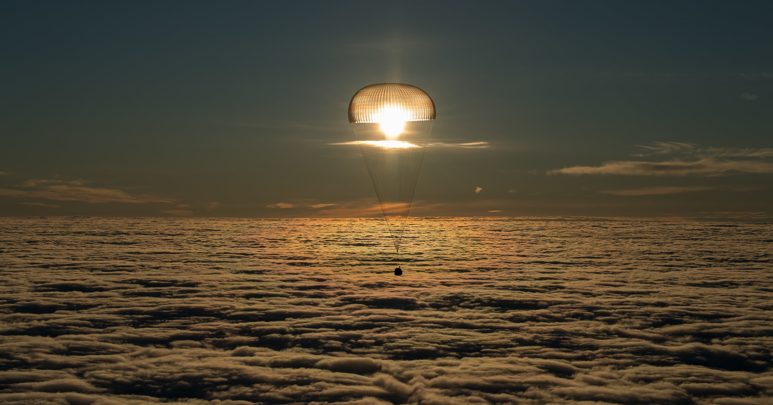 Soyuz MS-06 Space Capsule Landing with Parachute at Sunset HD Wallpaper