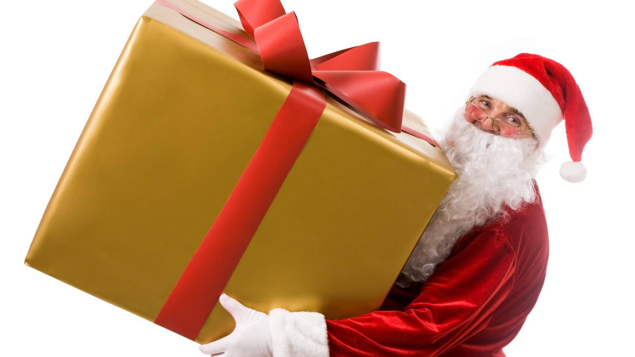 Santa Claus holding a large golden gift box HD Wallpaper