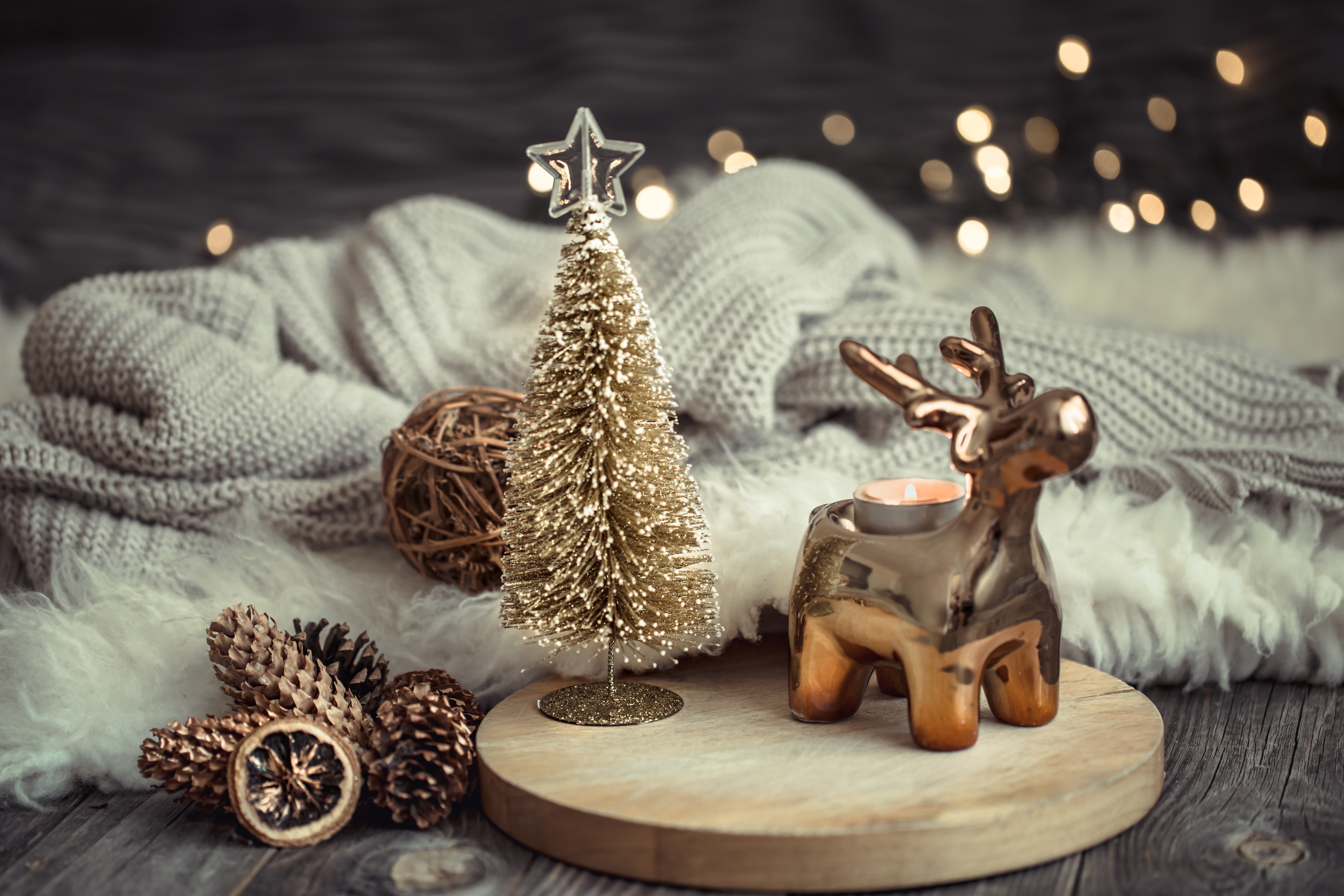 Christmas ornaments with reindeer candle holder and pine cones HD Wallpaper