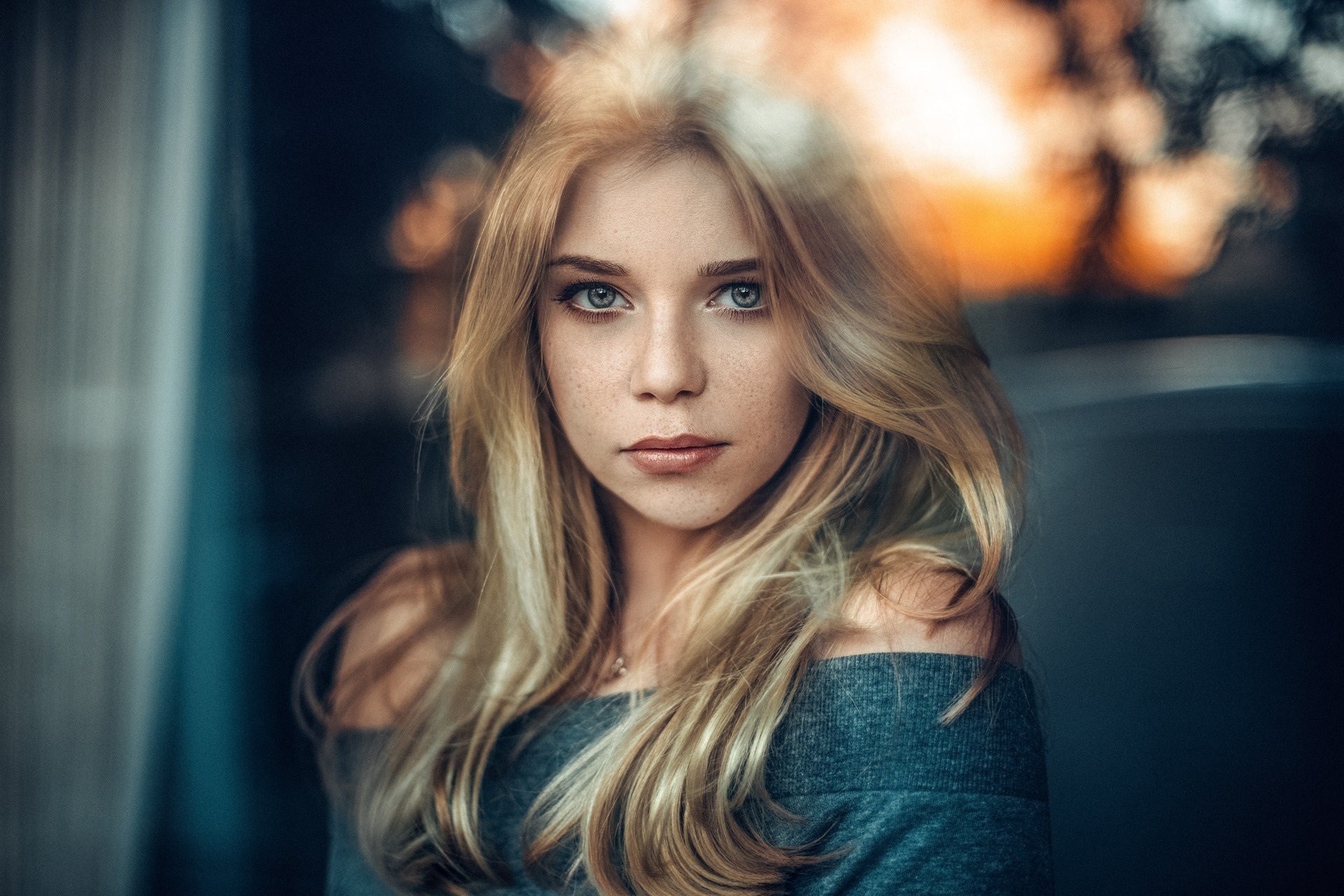 Young woman with blonde hair and freckles HD Wallpaper
