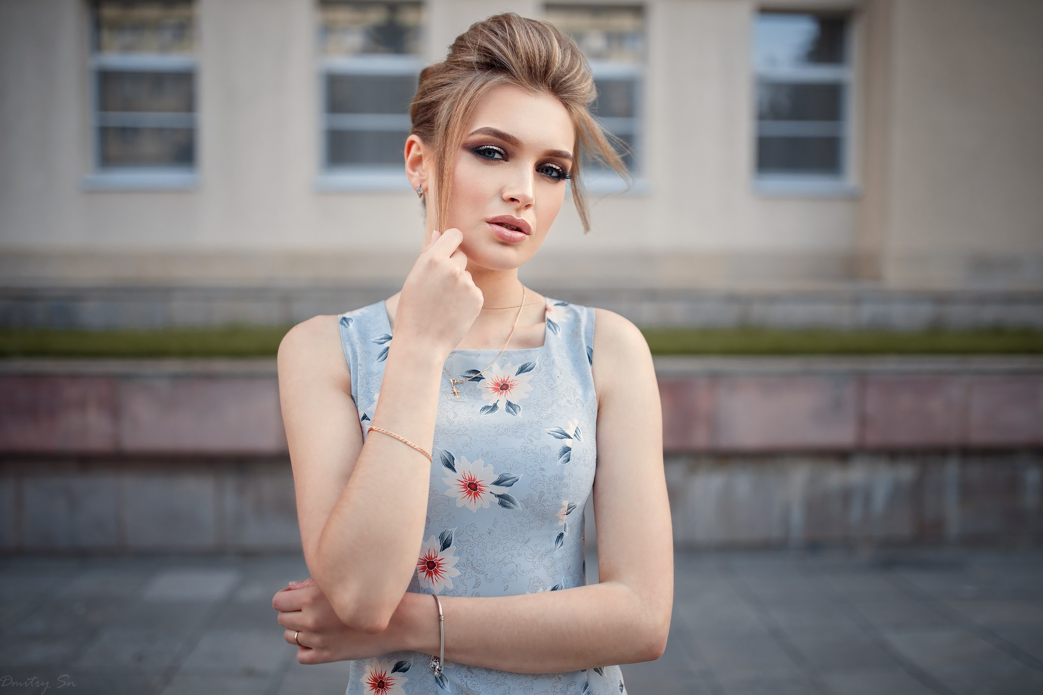 Woman in floral dress posing outdoors HD Wallpaper