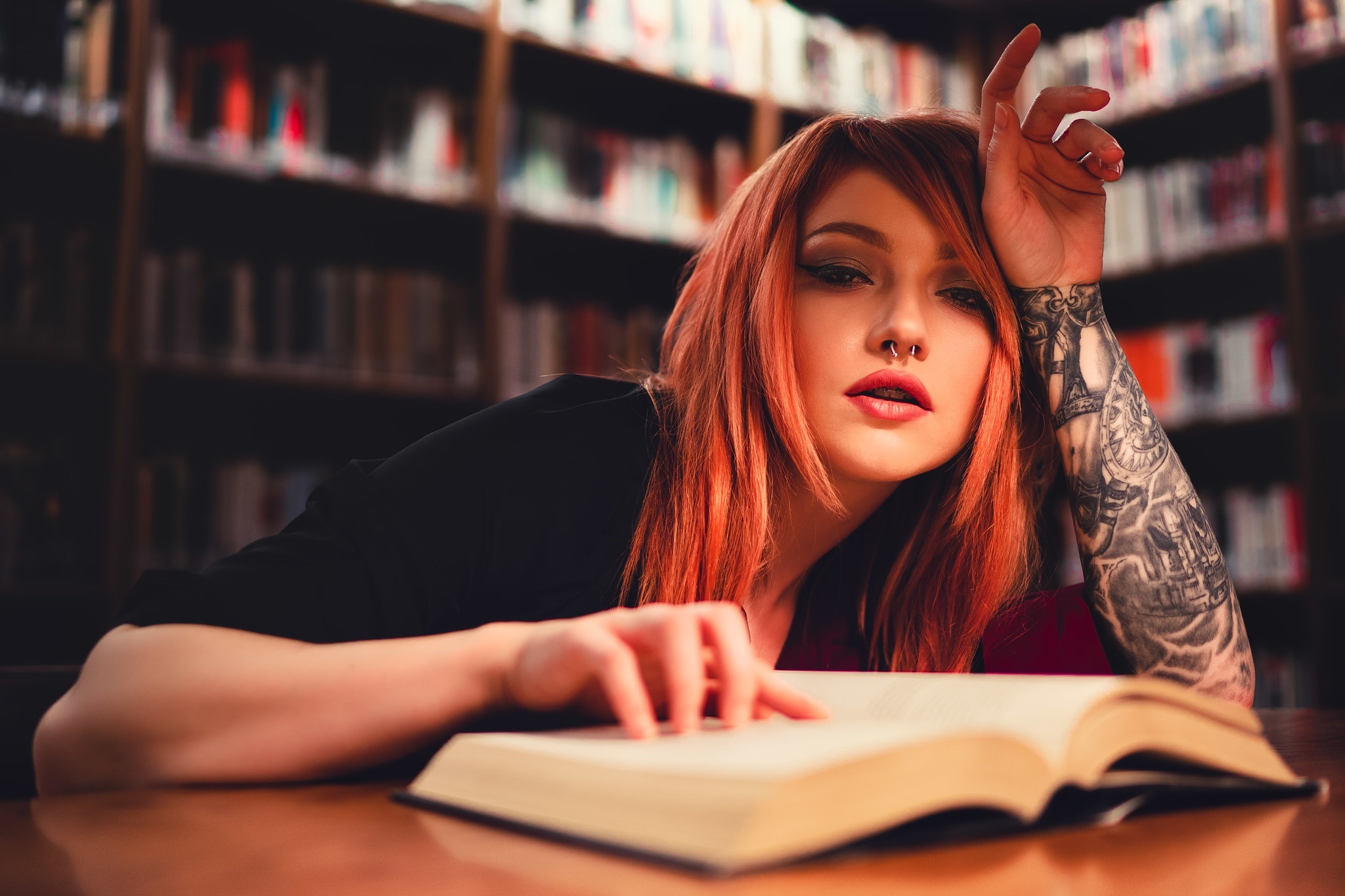 Woman with red hair and tattoos reading a book HD Wallpaper