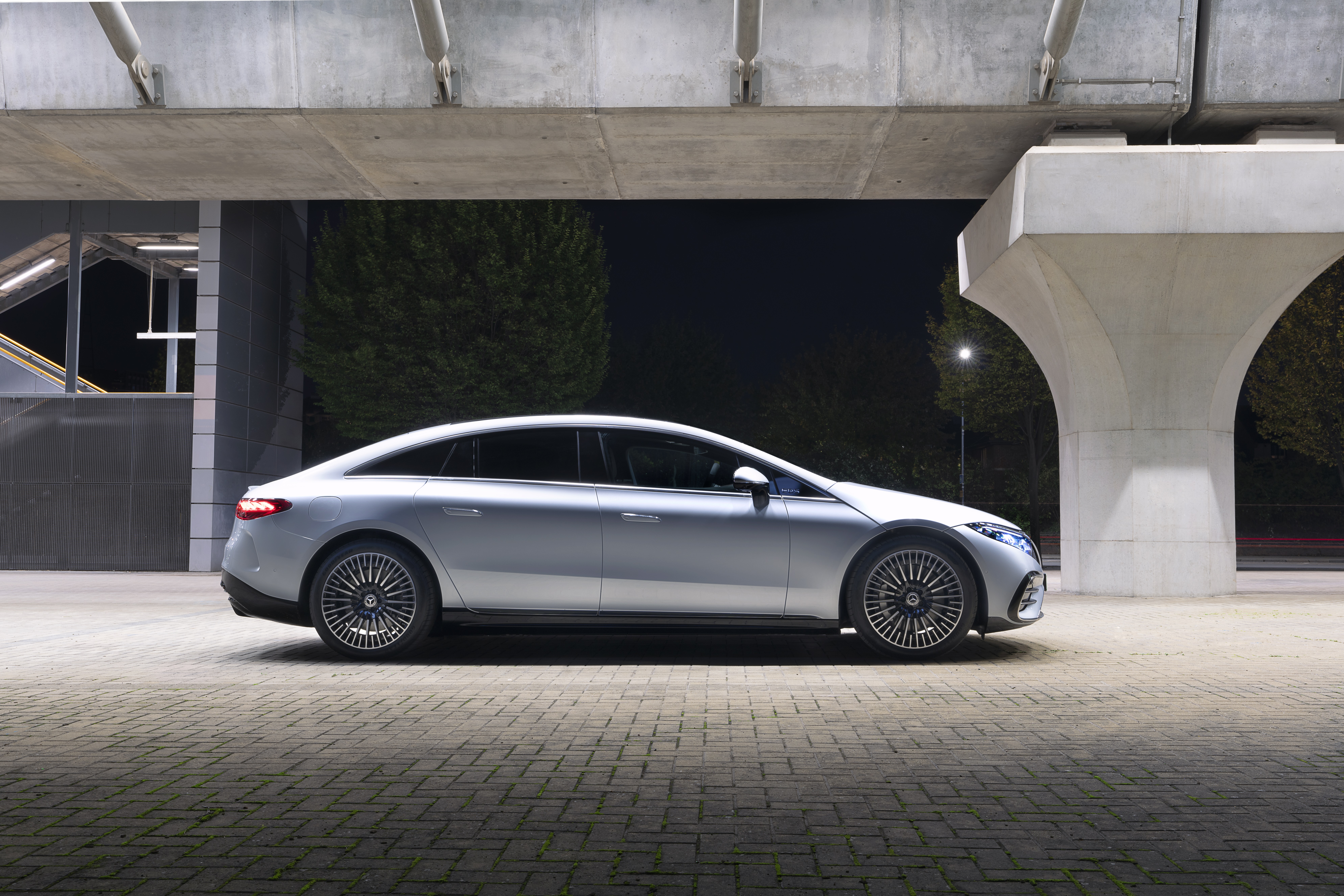 Silver Mercedes-Benz EQS 450 AMG Line parked under a bridge HD Wallpaper