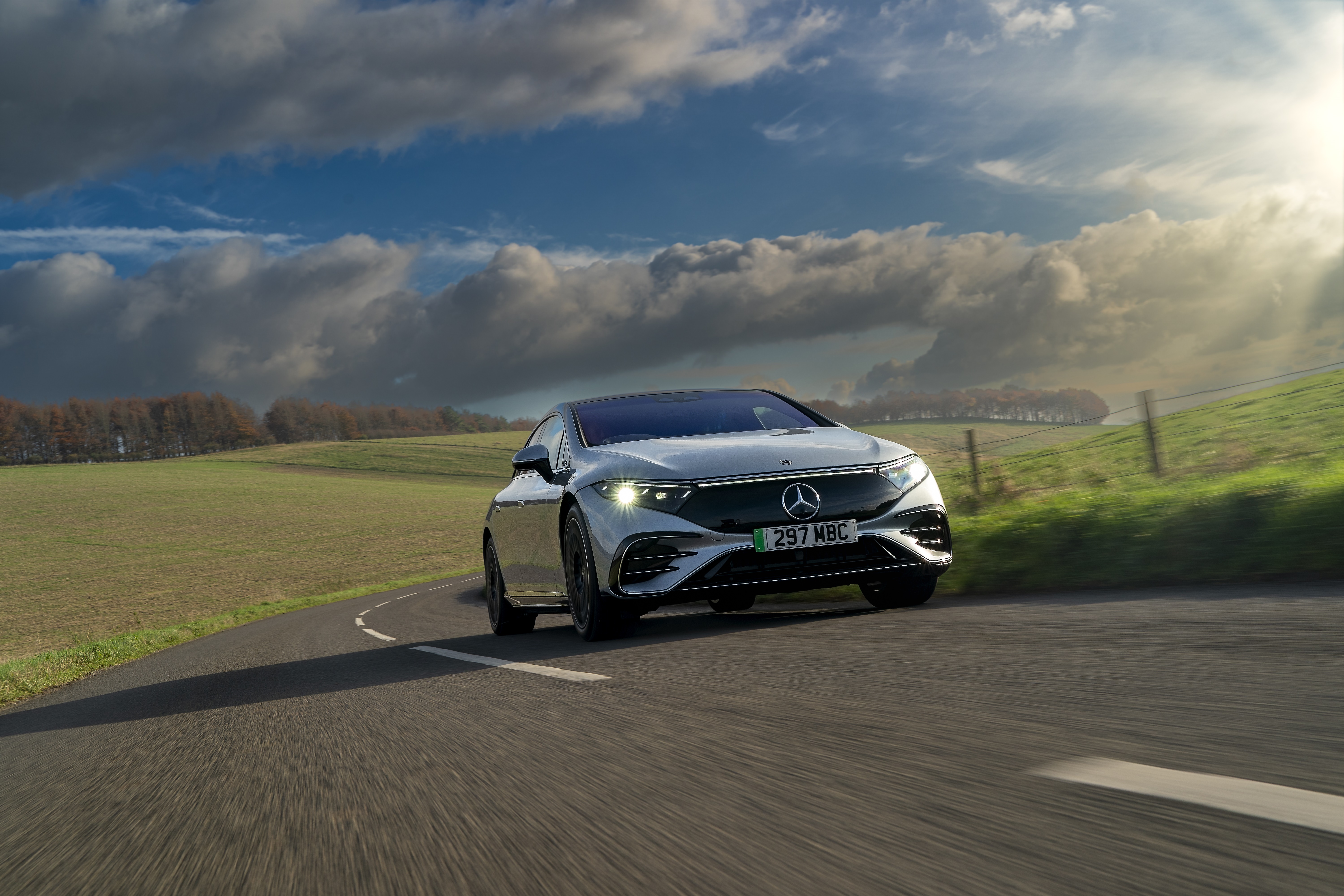 Mercedes-Benz EQS 450 AMG Line on a country road HD Wallpaper